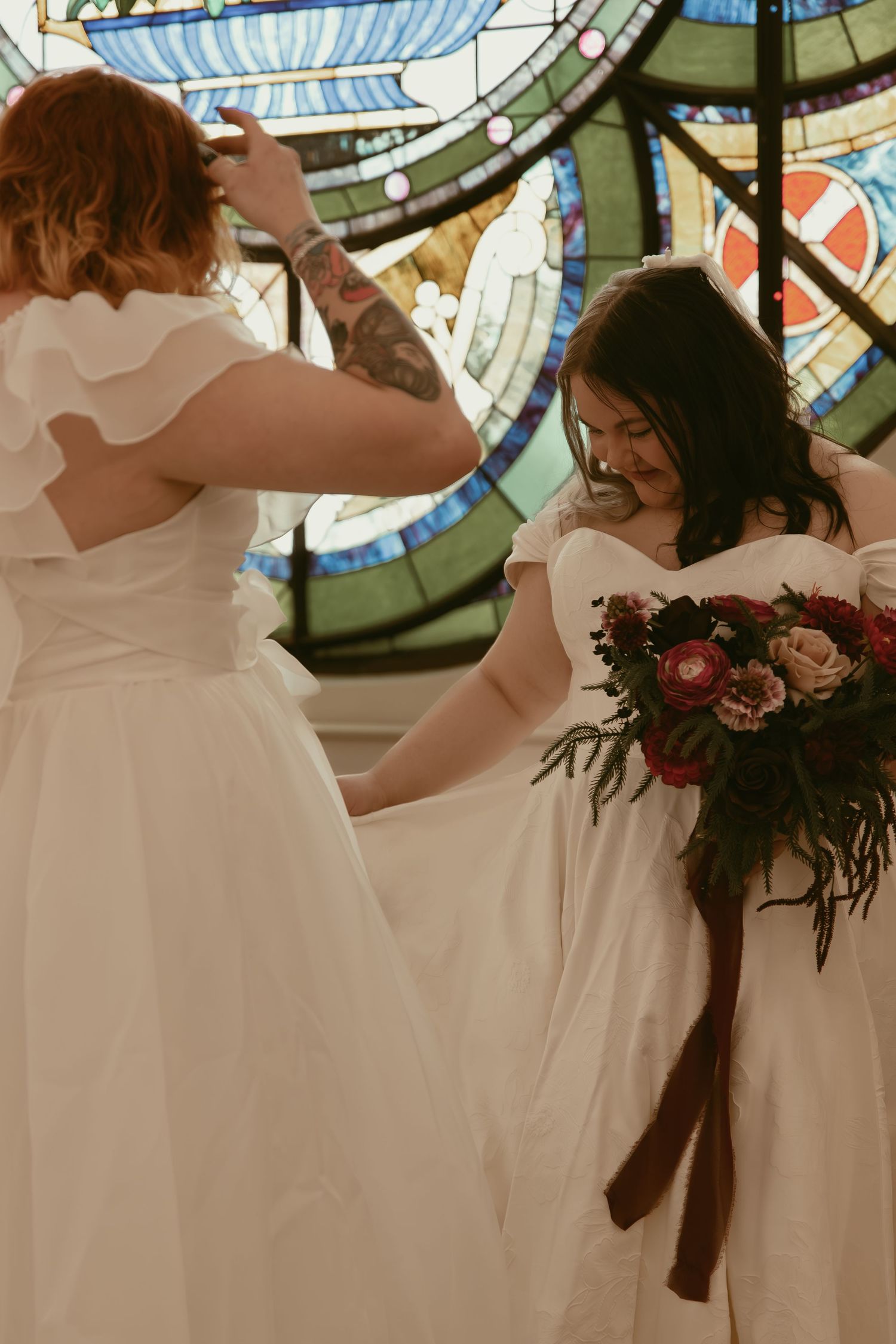 Two brides smiling at first look in Cleveland Ohio by Gypsy Lens Photography. Moody, filmy, vintage, documentary wedding photography.