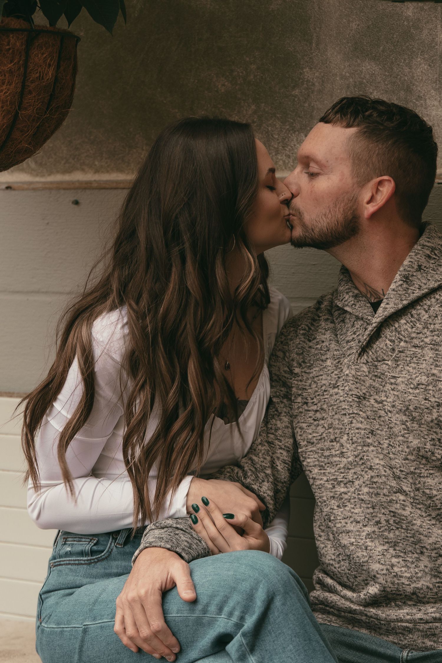 Couple kissing at greenhouse in Cleveland Ohio by Gypsy Lens Photography. Moody, filmy, vintage, documentary wedding photography