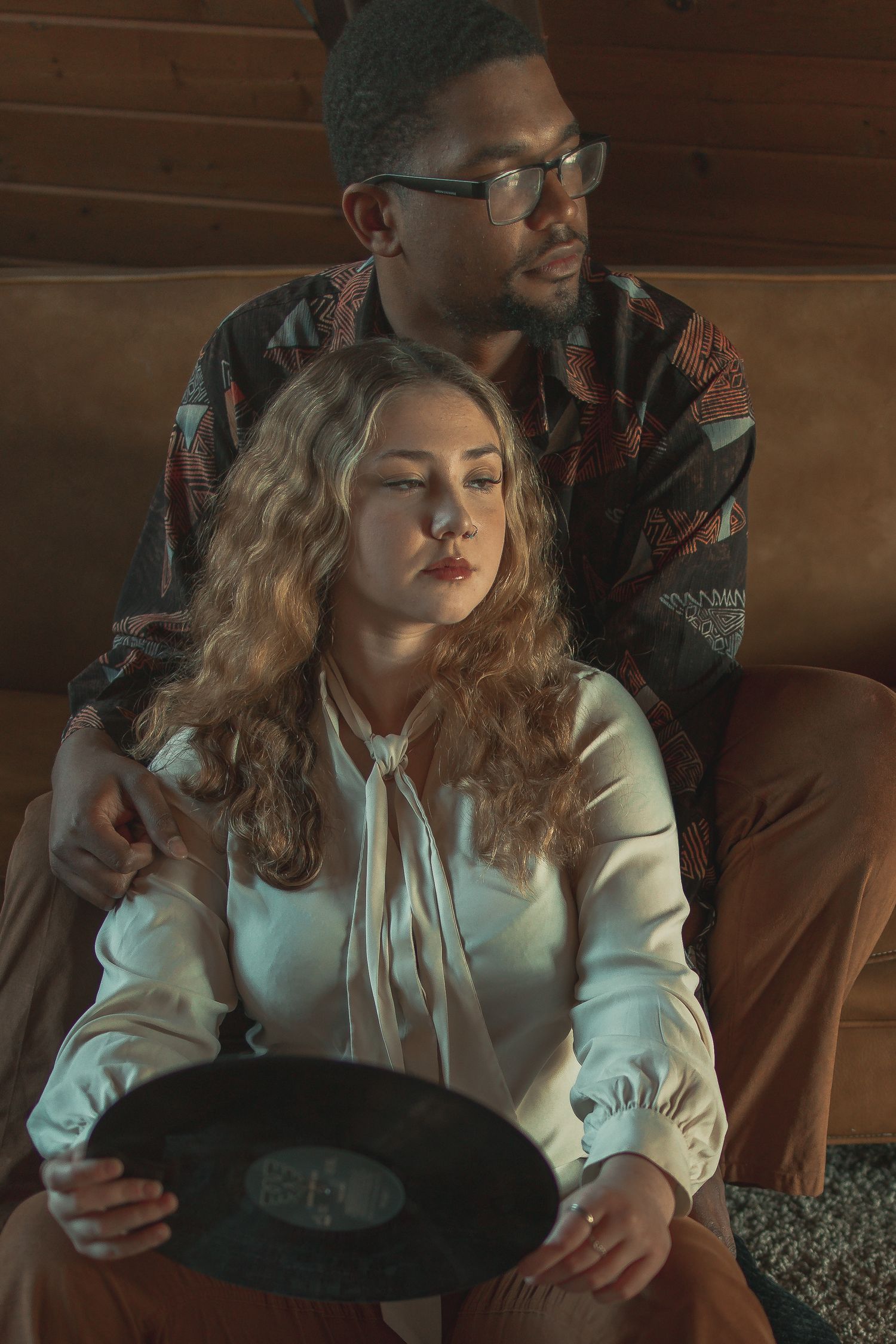 Vintage couple with record player in Akron Ohio by Gypsy Lens Photography. Moody, vintage, documentary wedding photography.