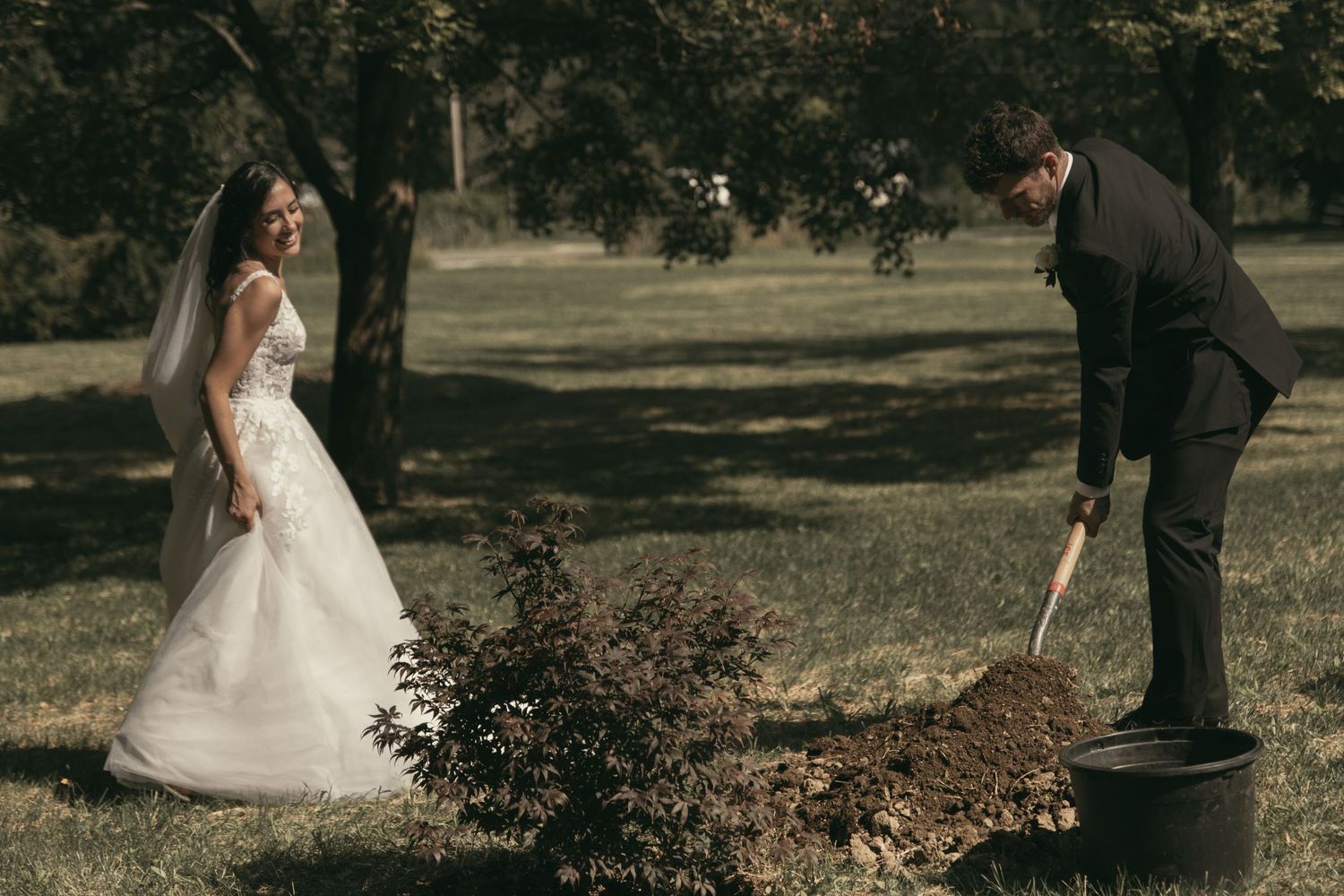 Bride and groom tree planting ceremony in backyard wedding in Tallmadge Ohio by Gypsy Lens Photography. Moody, vintage, Documentary.