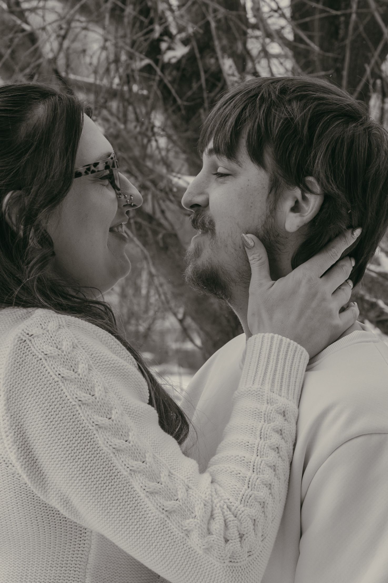 Intimate couple moment at covered bridge in Ashtabula Ohio by Gypsy Lens Photography. Moody, vintage, documentary wedding photographer.
