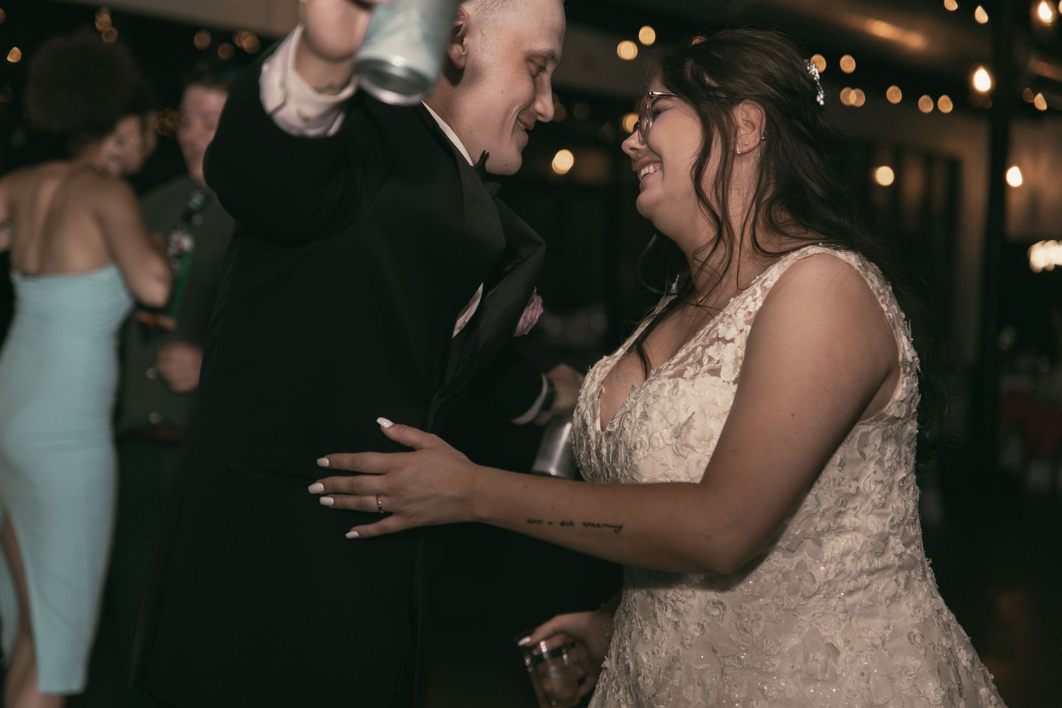 Bride and groom at reception in Cleveland Ohio by Gypsy Lens Photography. Moody, vintage, documentary wedding photographer.