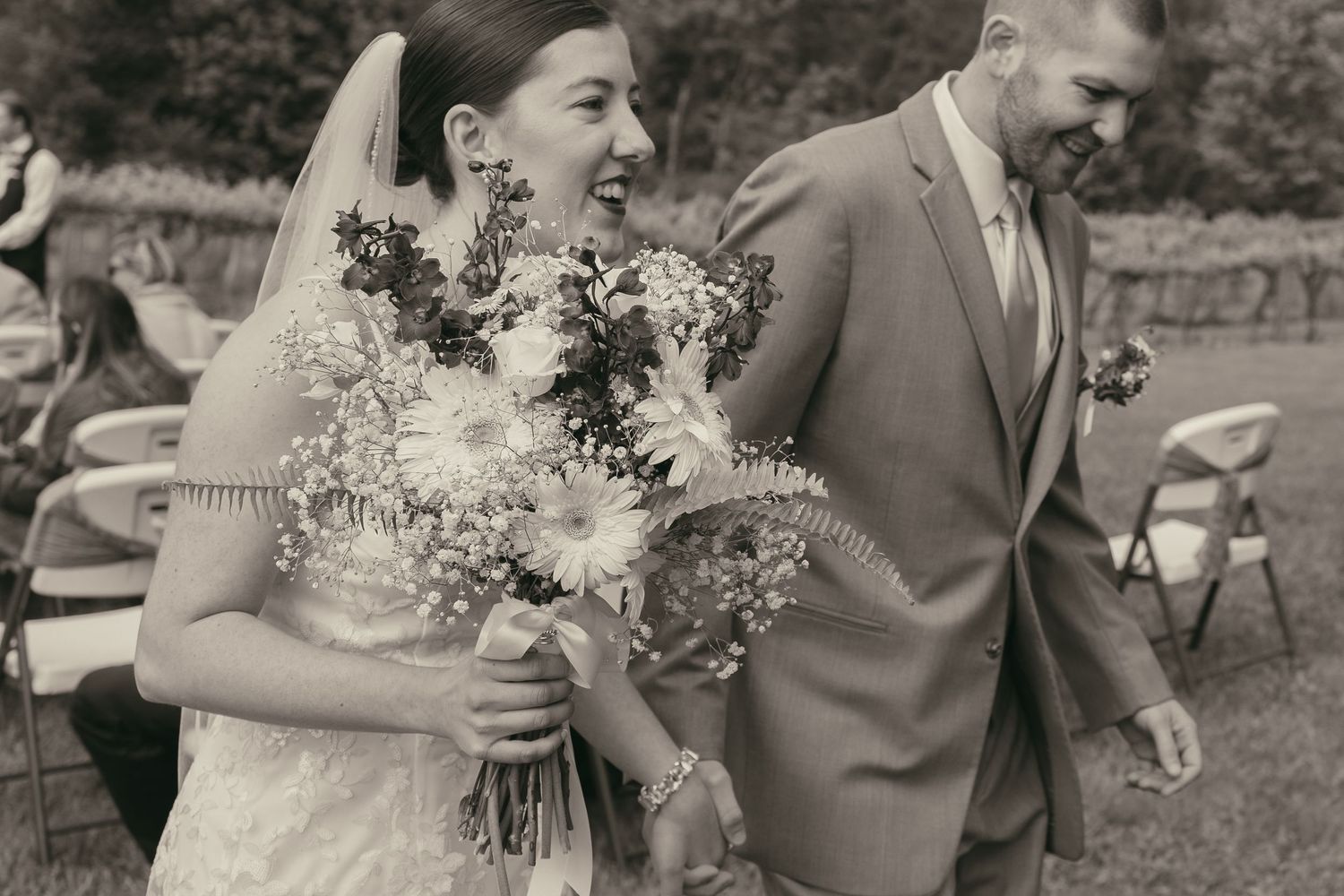 Bride and groom excited after just being married in Ashtabula Ohio by Gypsy Lens Photography. Moody, nostalgic, documentary wedding photo.