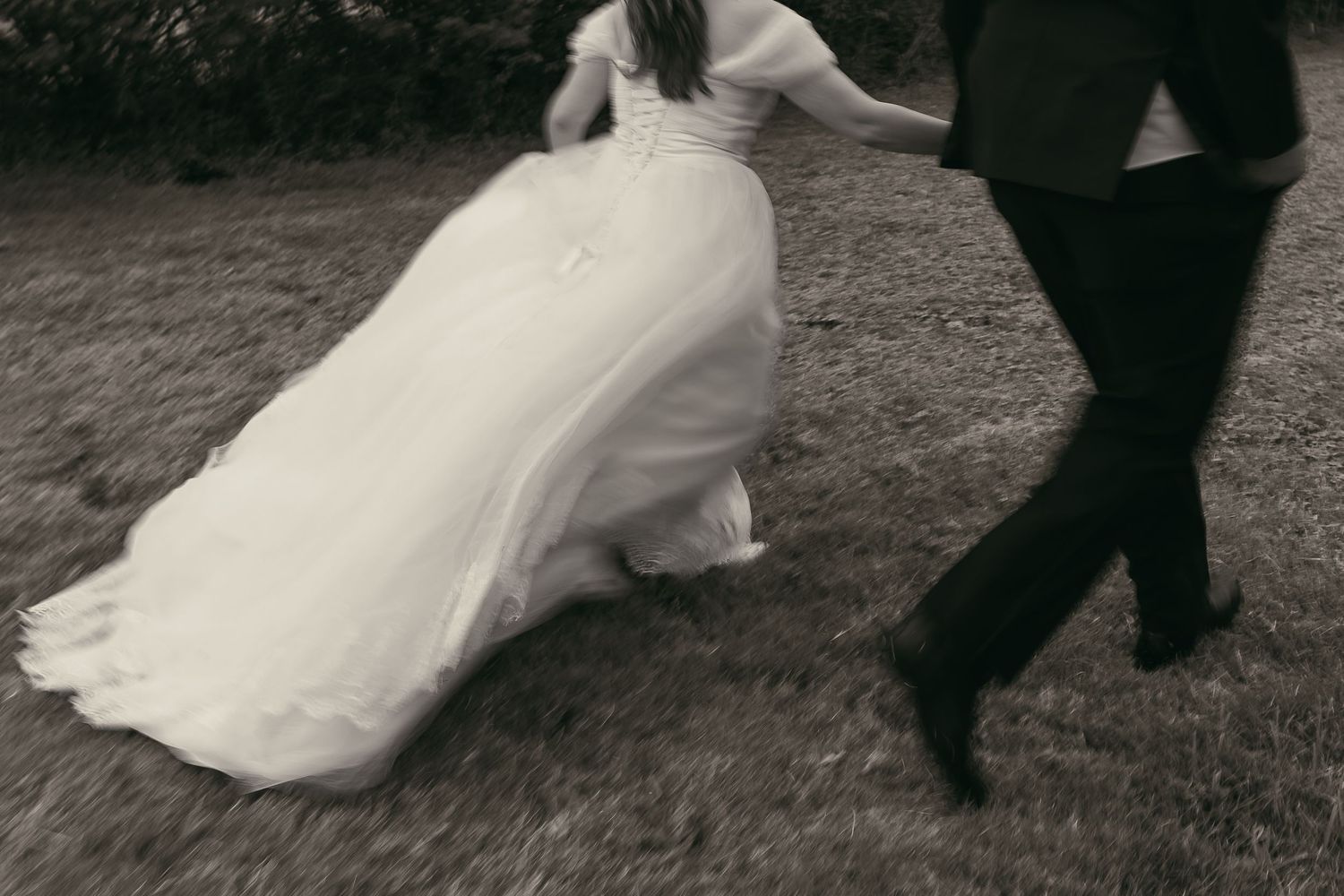 Motion blur artistic b&w couple running in Ashtabula Ohio by Gypsy Lens Photography. Moody, vintage, documentary wedding photography.