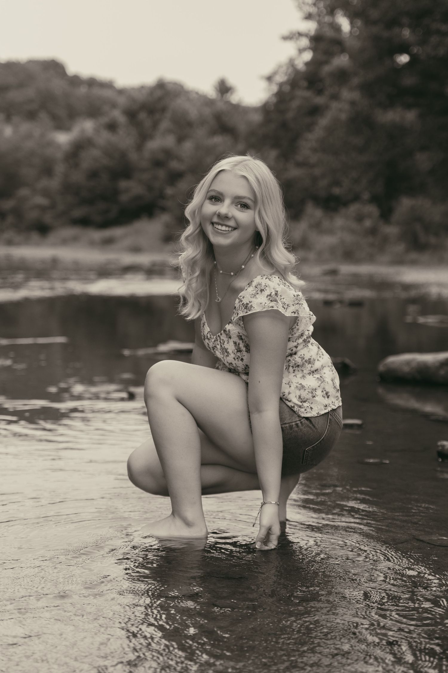 Scenic creek senior portraits in Ashtabula Ohio by Gypsy Lens Photography. Moody, filmy, vintage, documentary wedding photography.