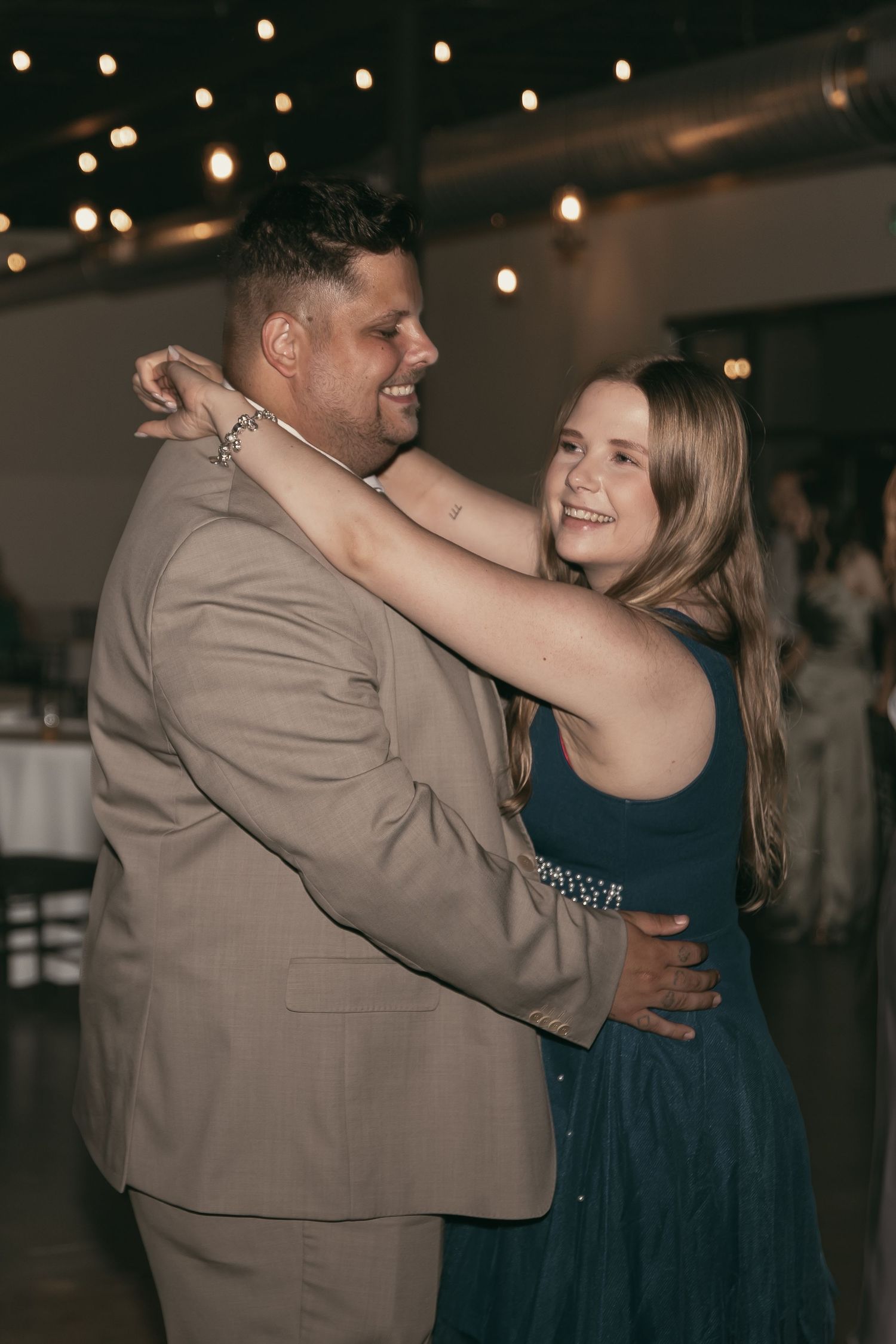 Wedding guests dancing at reception in Cleveland Ohio by Gypsy Lens Photography. Moody, vintage, documentary wedding photographer.