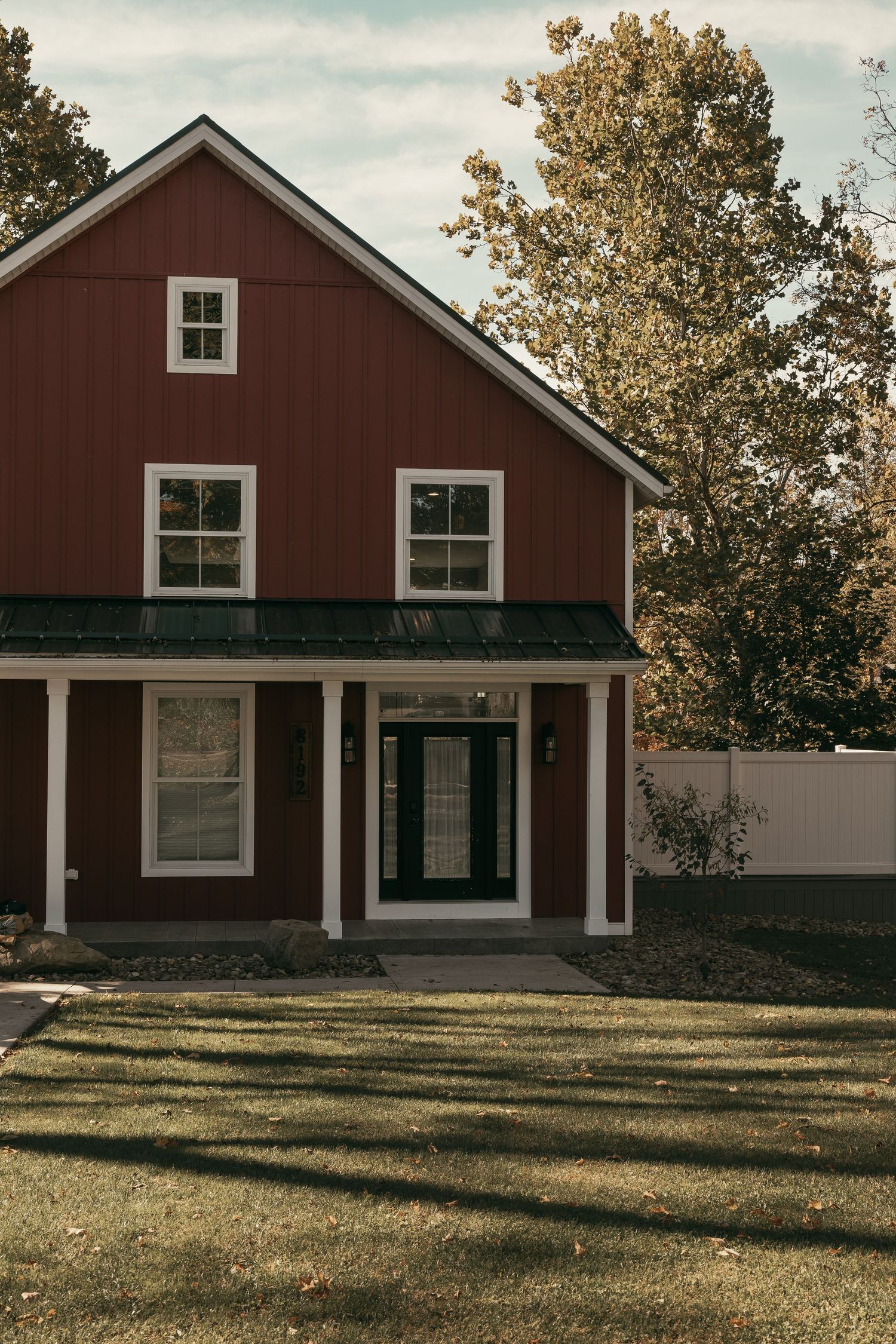 Red farm house getting ready location in Cleveland Ohio by Gypsy Lens Photography. Moody, vintage, documentary wedding photography.