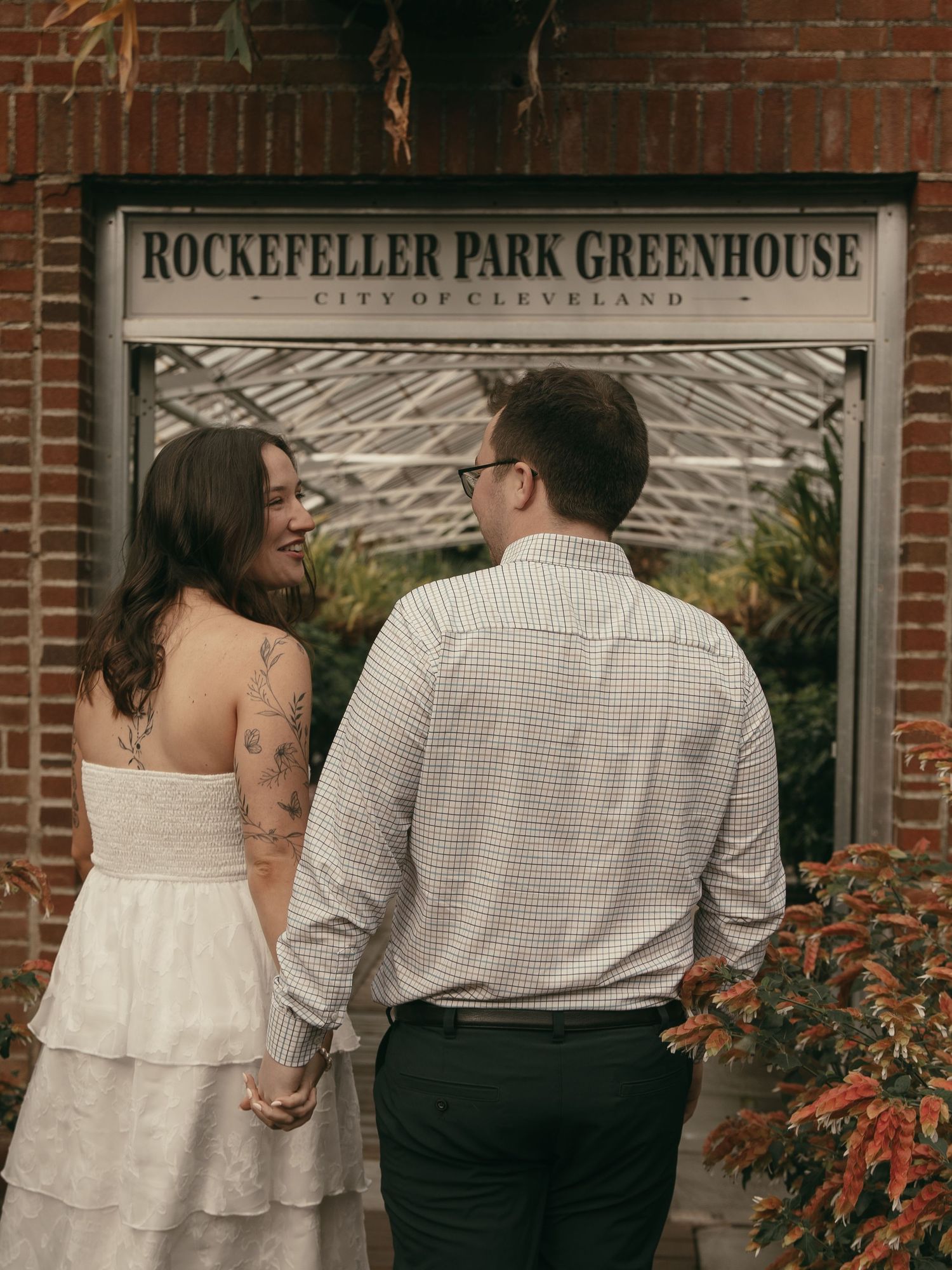 Engaged couple at greenhouse in Cleveland Ohio by Gypsy Lens Photography. Moody, nostalgic, vintage, documentary wedding photography