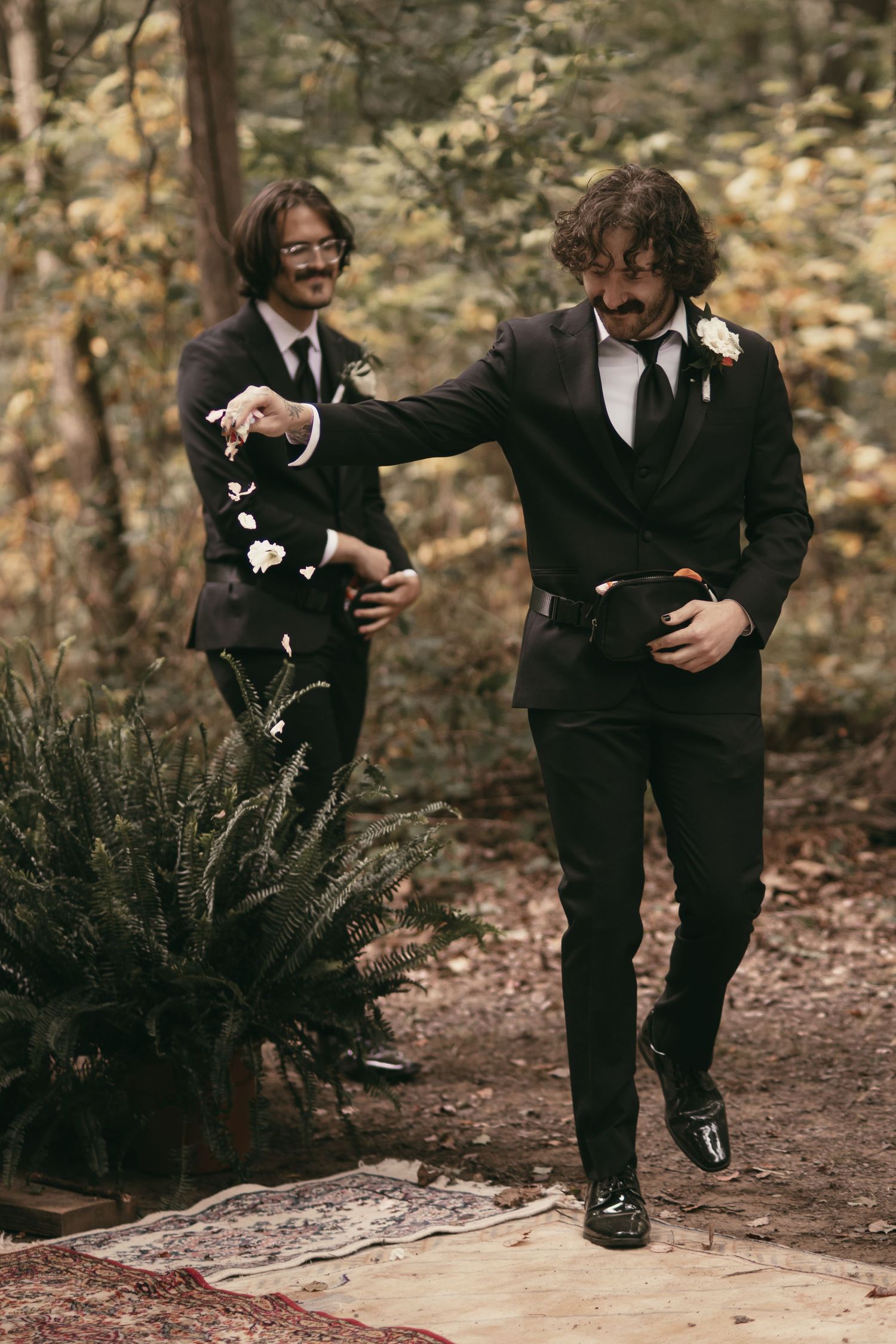 Groomsmen dropping flower petals in Hermitage PA by Gypsy Lens Photography. Moody, filmy, vintage, documentary wedding photography.