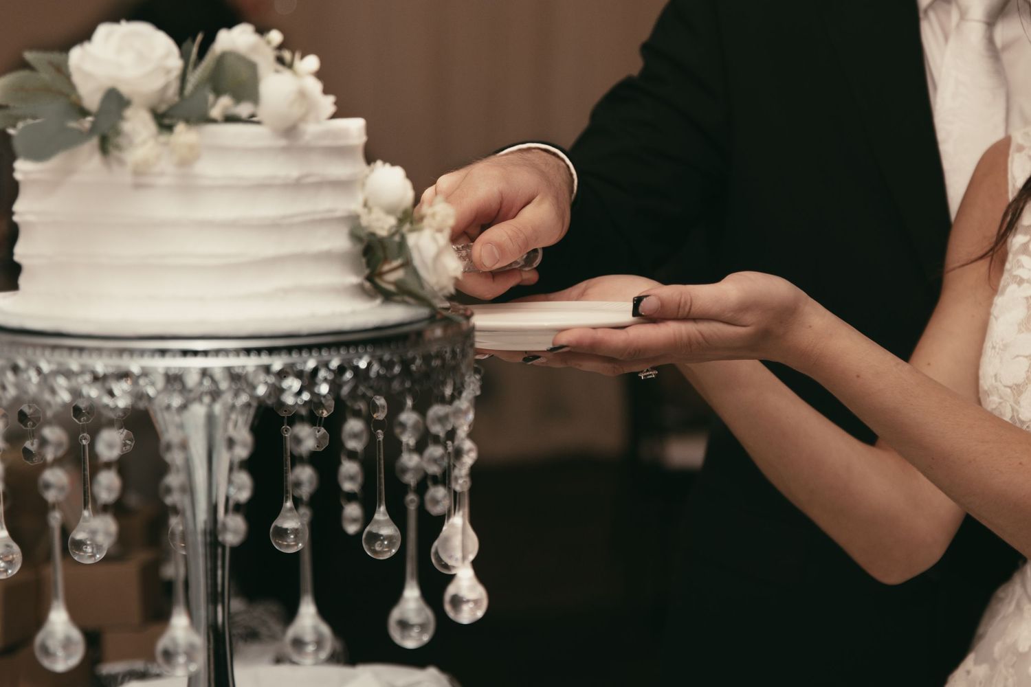 Newlyweds cutting cake in Tallmadge Ohio by Gypsy Lens Photography. Moody, vintage, nostalgic, documentary wedding.