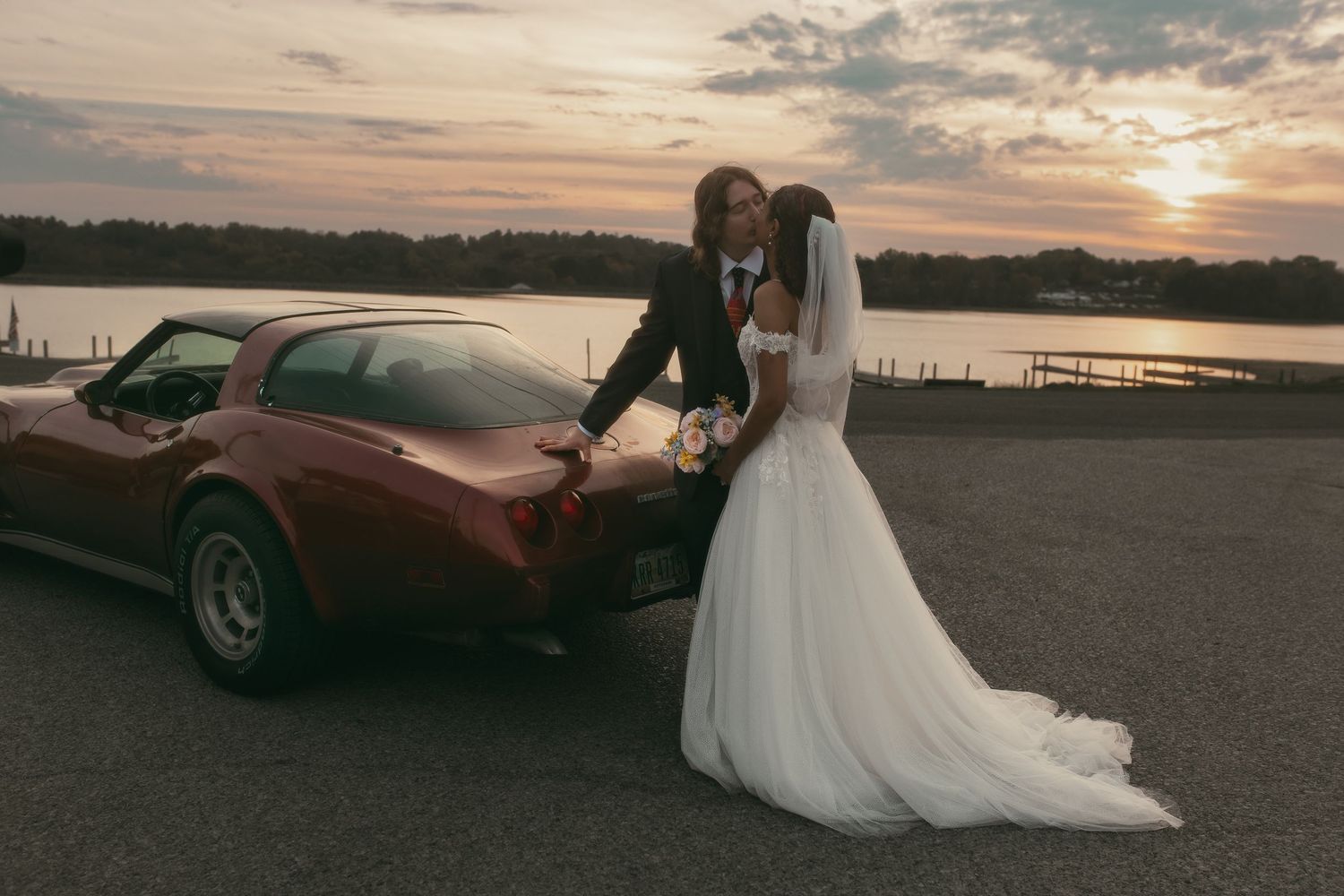 Romantic sunset newlyweds kissing in Cleveland Ohio by Gypsy Lens Photography. Moody, vintage, documentary wedding photography.