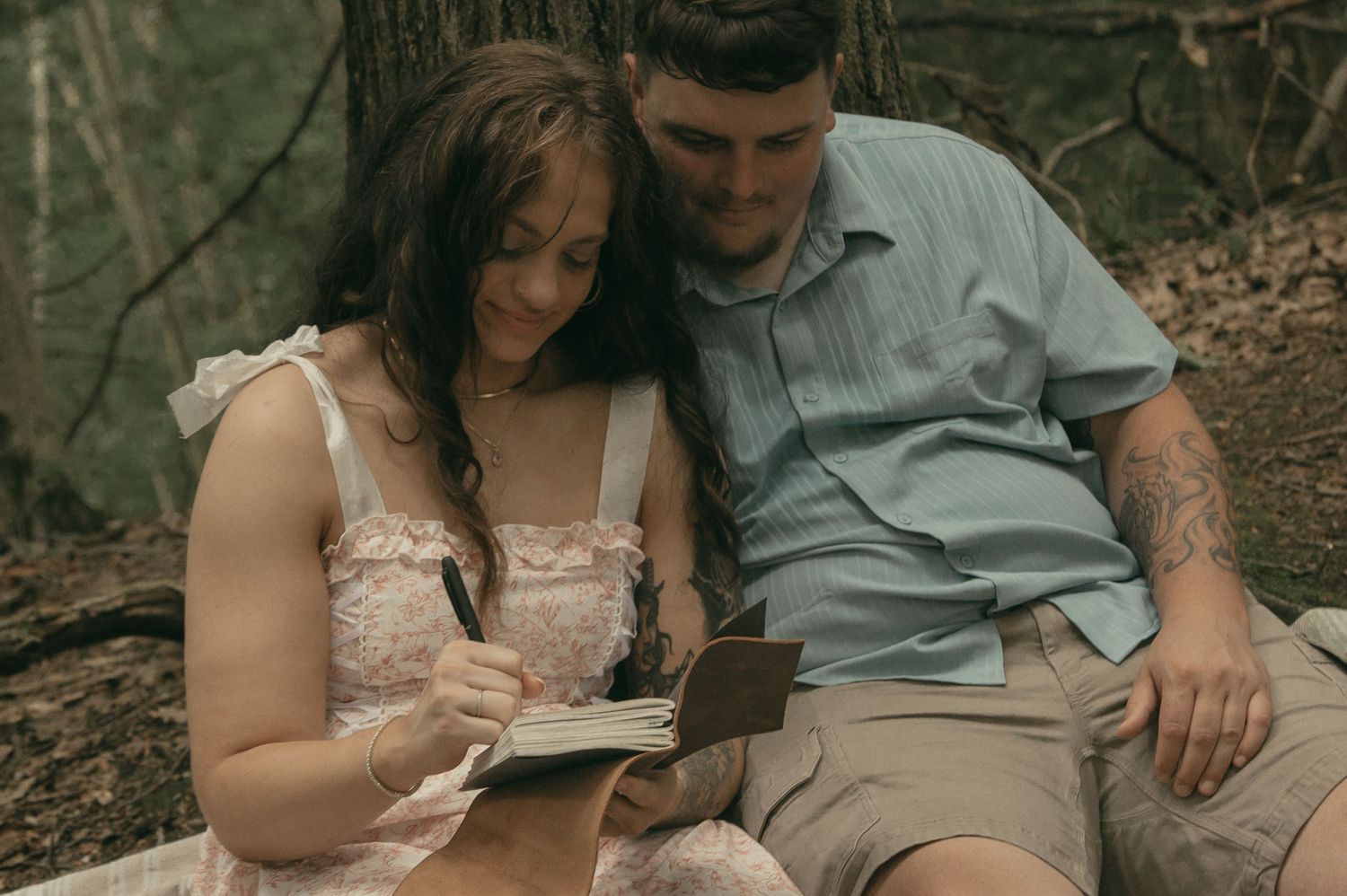 Engaged couple having a picnic in Lake County Ohio by Gypsy Lens Photography. Moody, filmy, vintage, documentary wedding photography