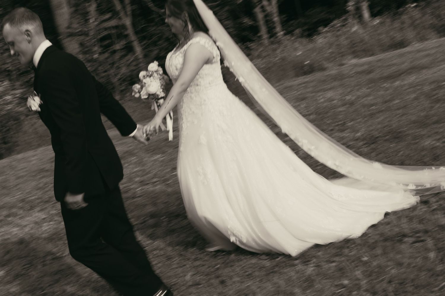 Bride and groom walking motion blur in Cleveland Ohio by Gypsy Lens Photography. Moody, filmy, vintage, documentary wedding photography.