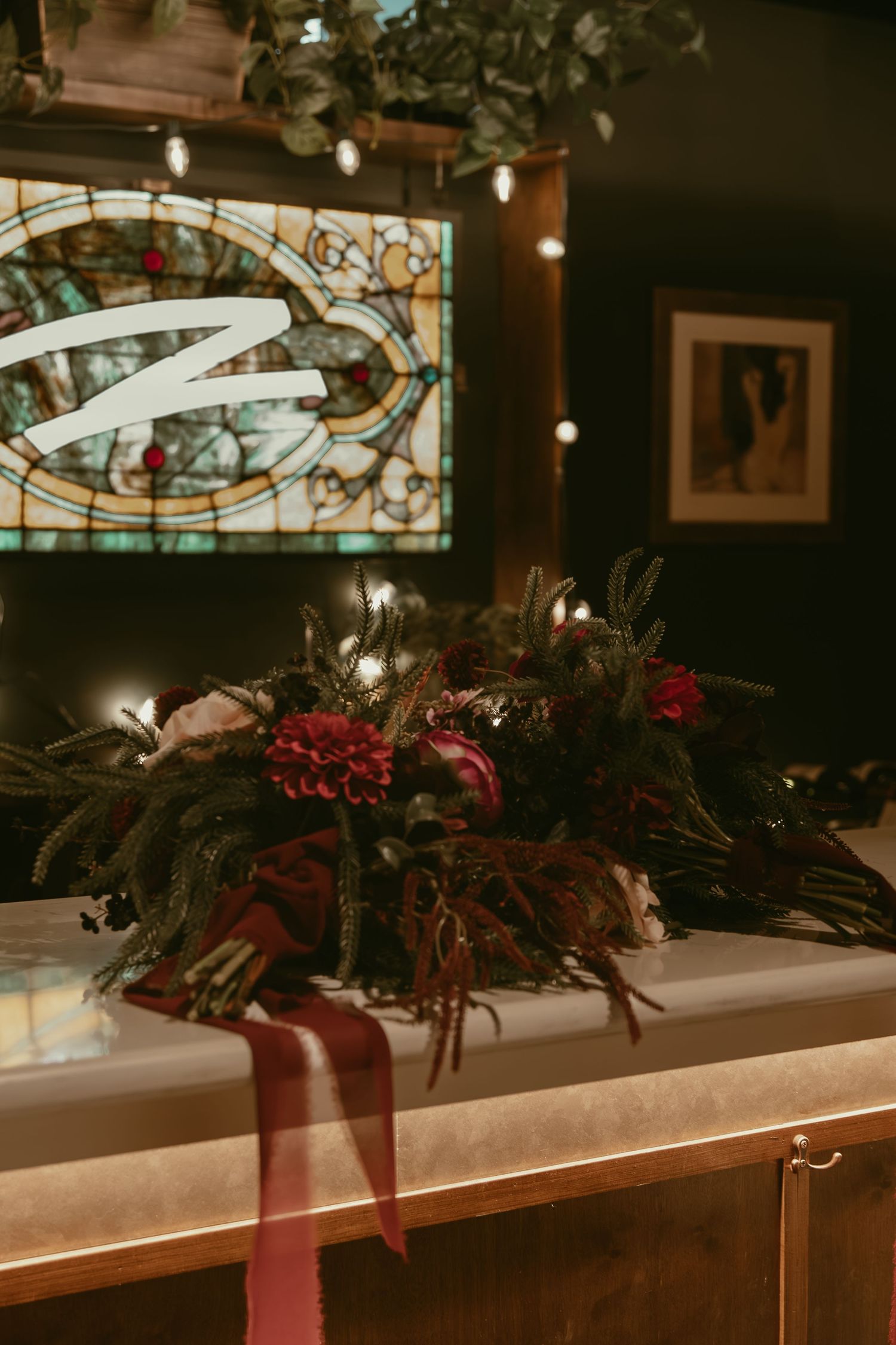 Two brides bouquets at bar in Cleveland Ohio by Gypsy Lens Photography. Moody, filmy, vintage, documentary wedding photography.