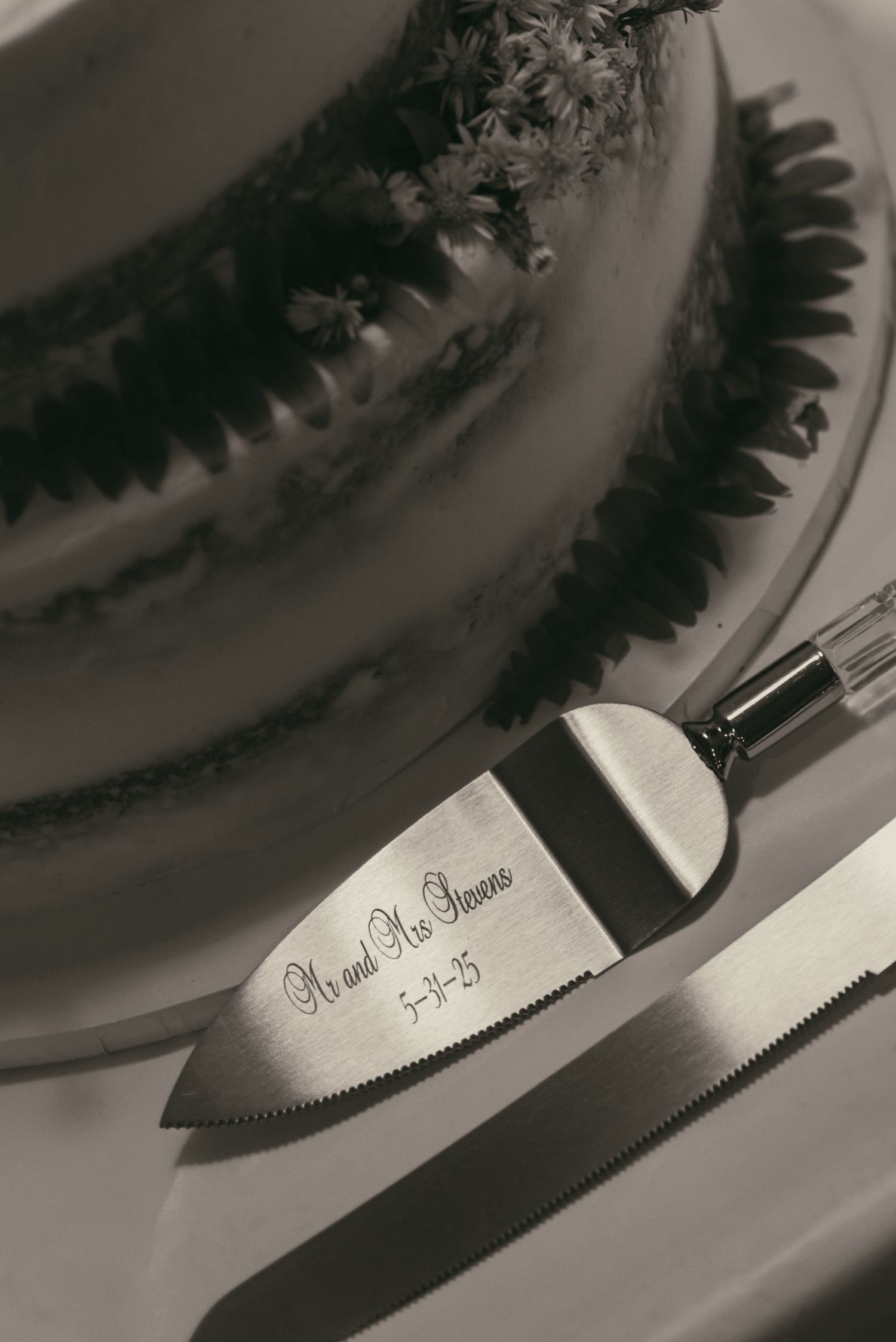 Close up detail of cake cutting in Ashtabula Ohio by Gypsy Lens Photography. Moody, vintage, nostalgic documentary wedding photographer.