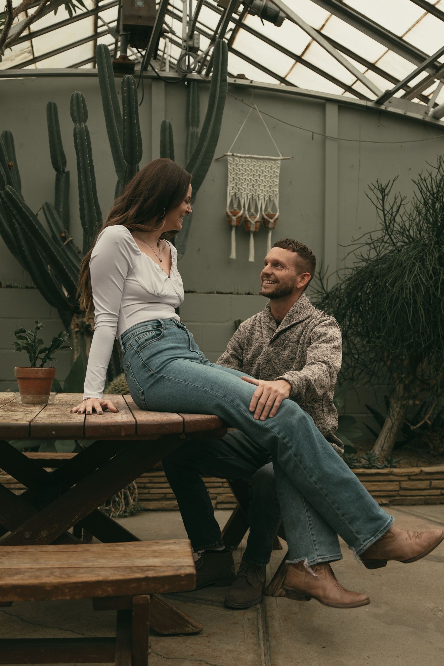Couple having picnic at greenhouse in Cleveland Ohio by Gypsy Lens Photography. Moody, filmy, vintage, documentary wedding photography