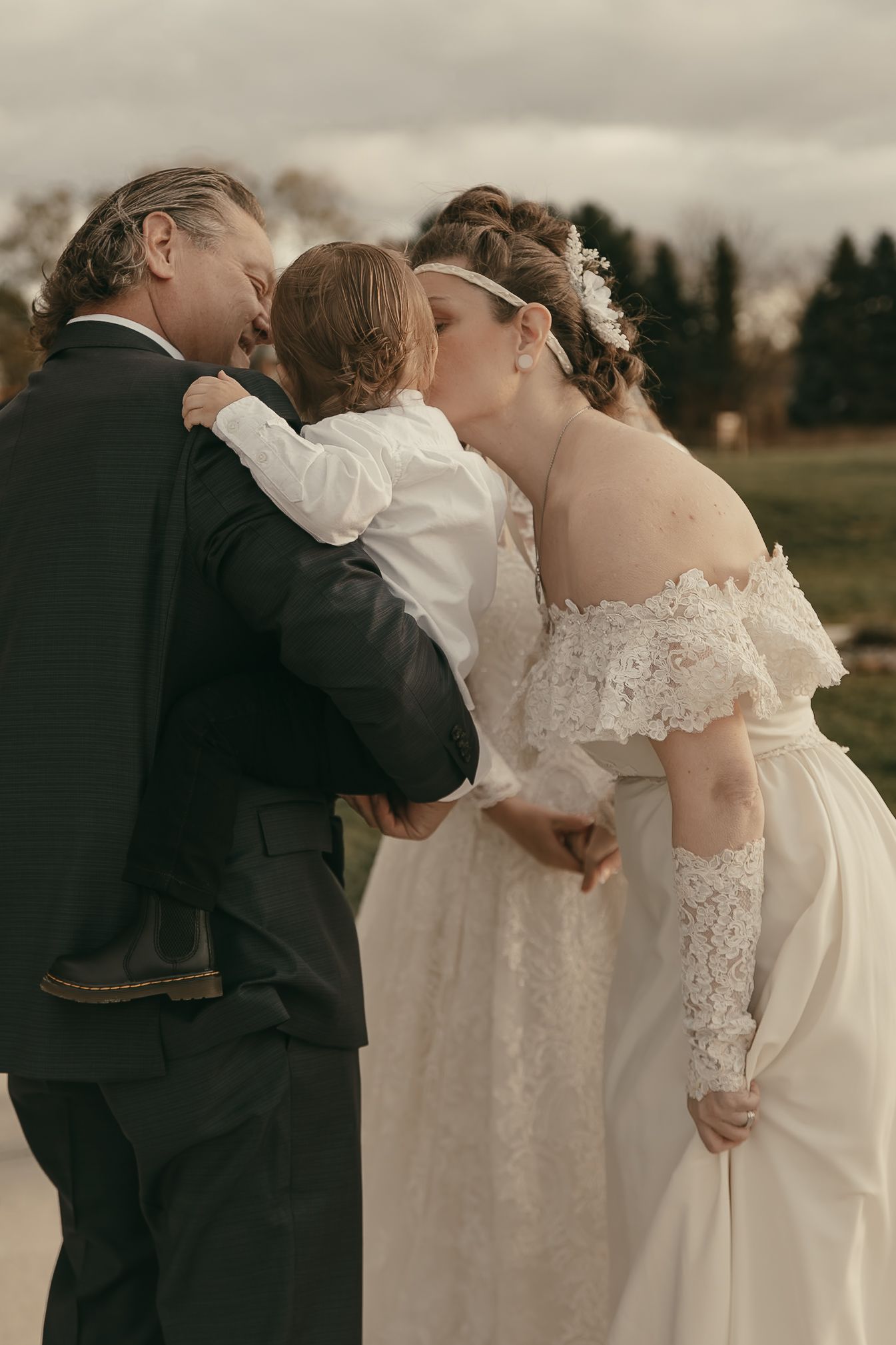 Cinematic sunset family portraits at wedding in Lake County Ohio by Gypsy Lens Photography. Moody, vintage, documentary wedding photography.