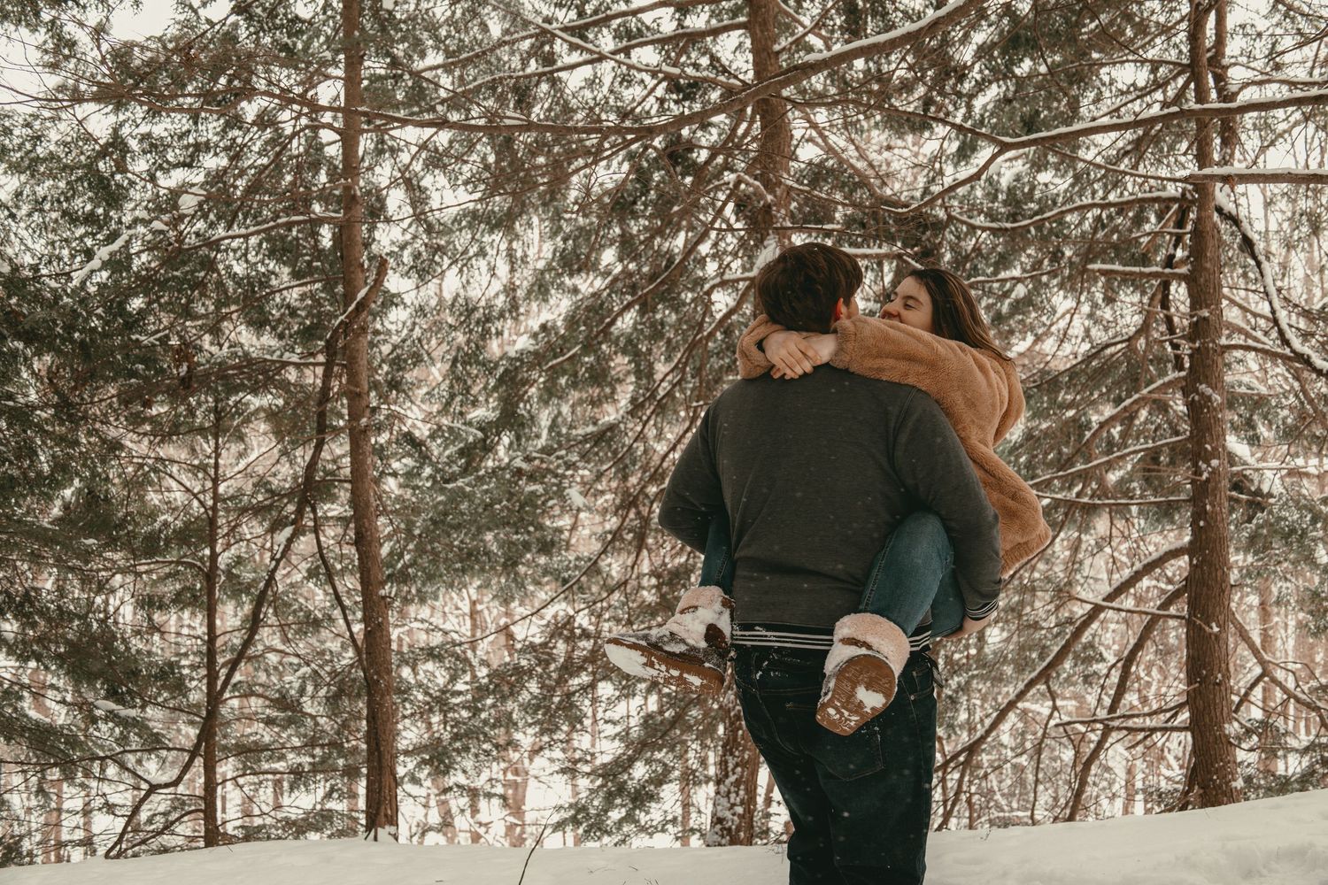 Engagement session couple spinning in Lake County Ohio by Gypsy Lens Photography. Moody, vintage, documentary wedding photographer.