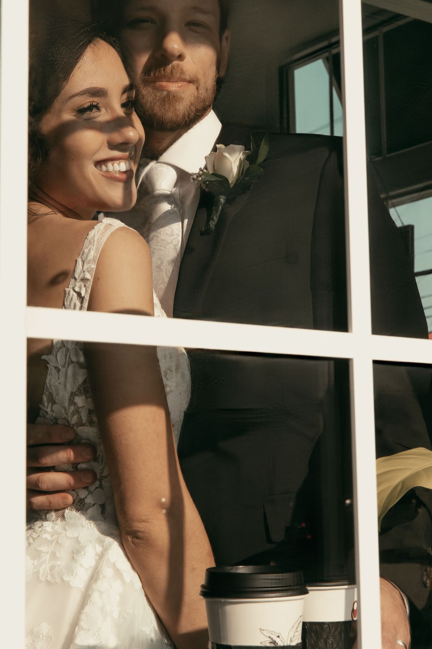 Wedding couple sharing coffee through window panes in  in Tallmadge Ohio by Gypsy Lens Photography. Moody, vintage, documentary wedding.