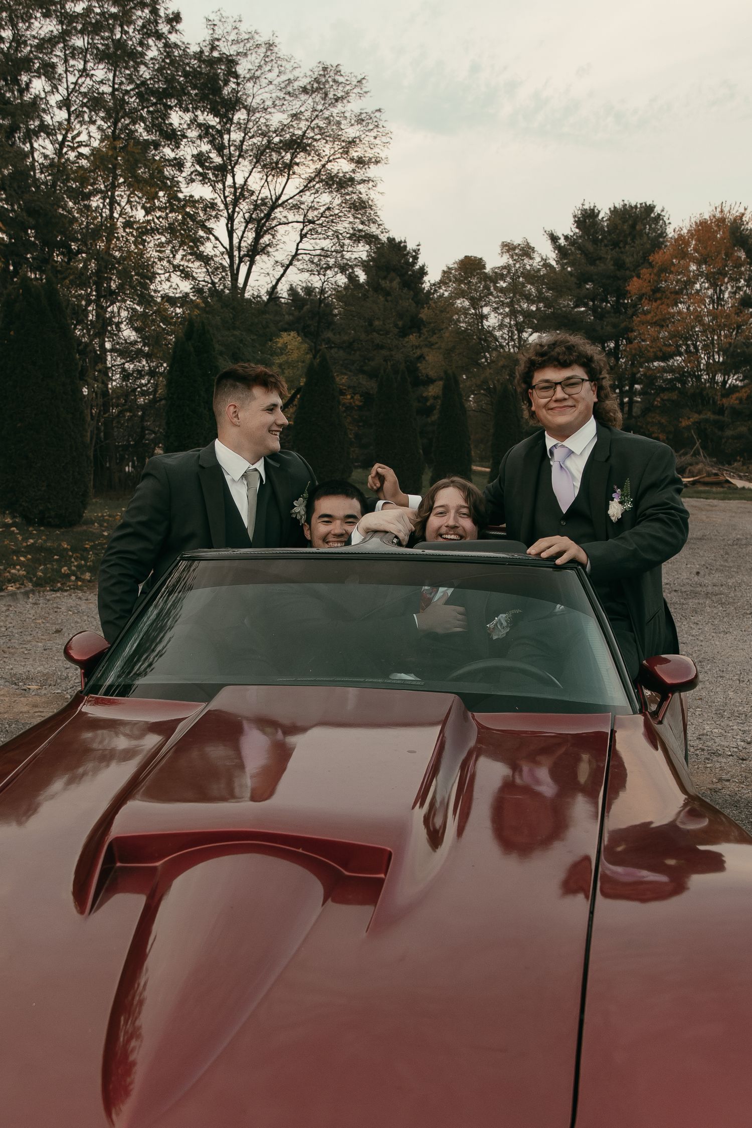 Groomsmen photos in vintage car in Cleveland Ohio by Gypsy Lens Photography. Moody, vintage, documentary wedding photography.