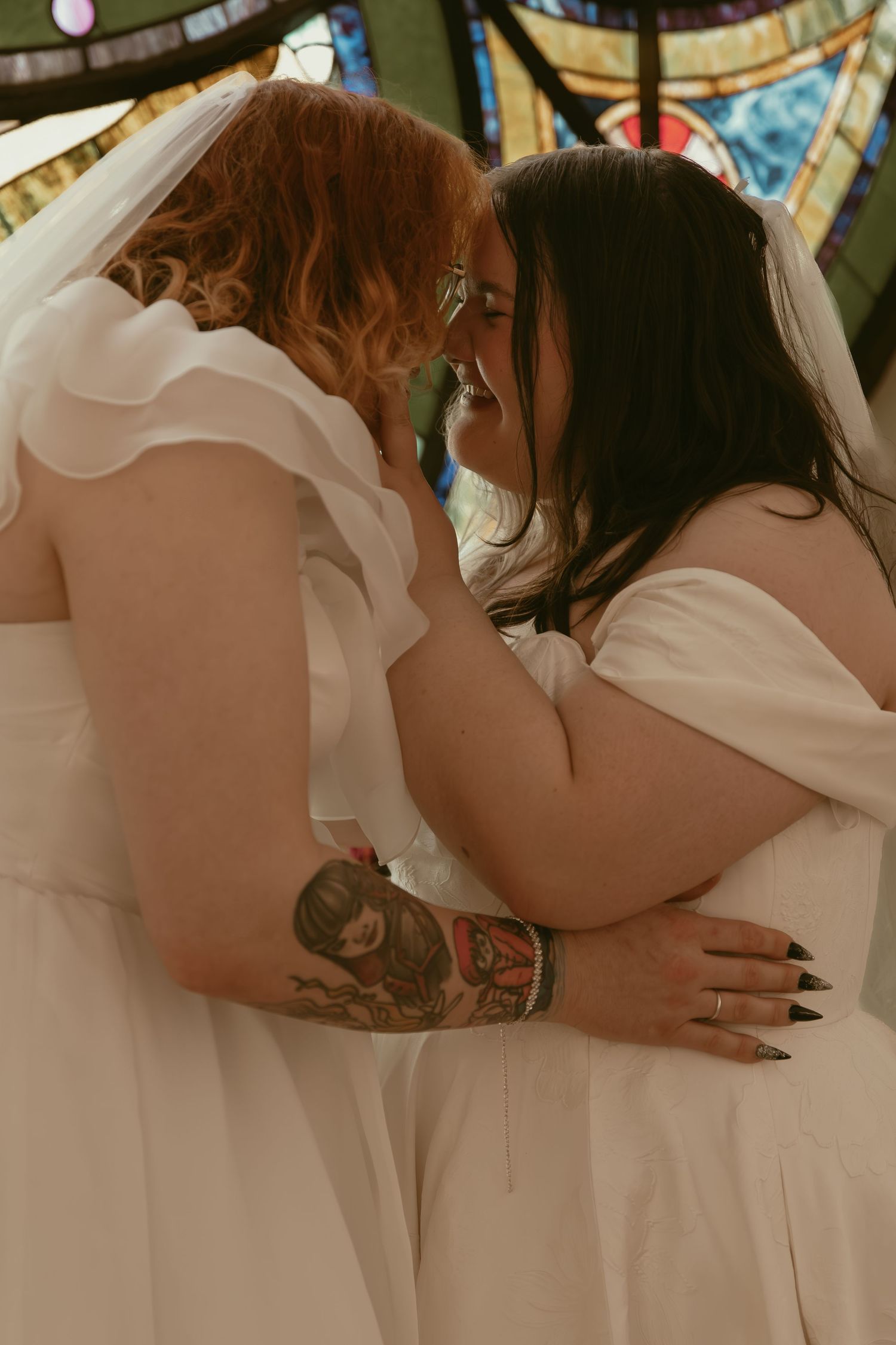 Two brides being intimate in Cleveland Ohio by Gypsy Lens Photography. Moody, filmy, vintage, documentary wedding photography.