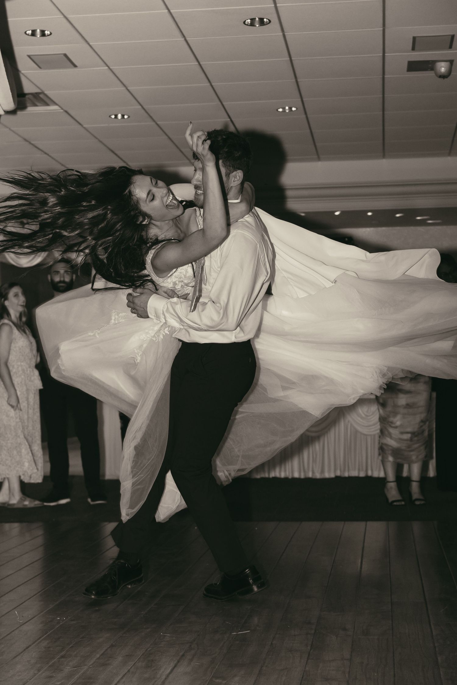 Bride and groom sharing a fun dance in Tallmadge Ohio by Gypsy Lens Photography, a documentary wedding storyteller, candid reception image