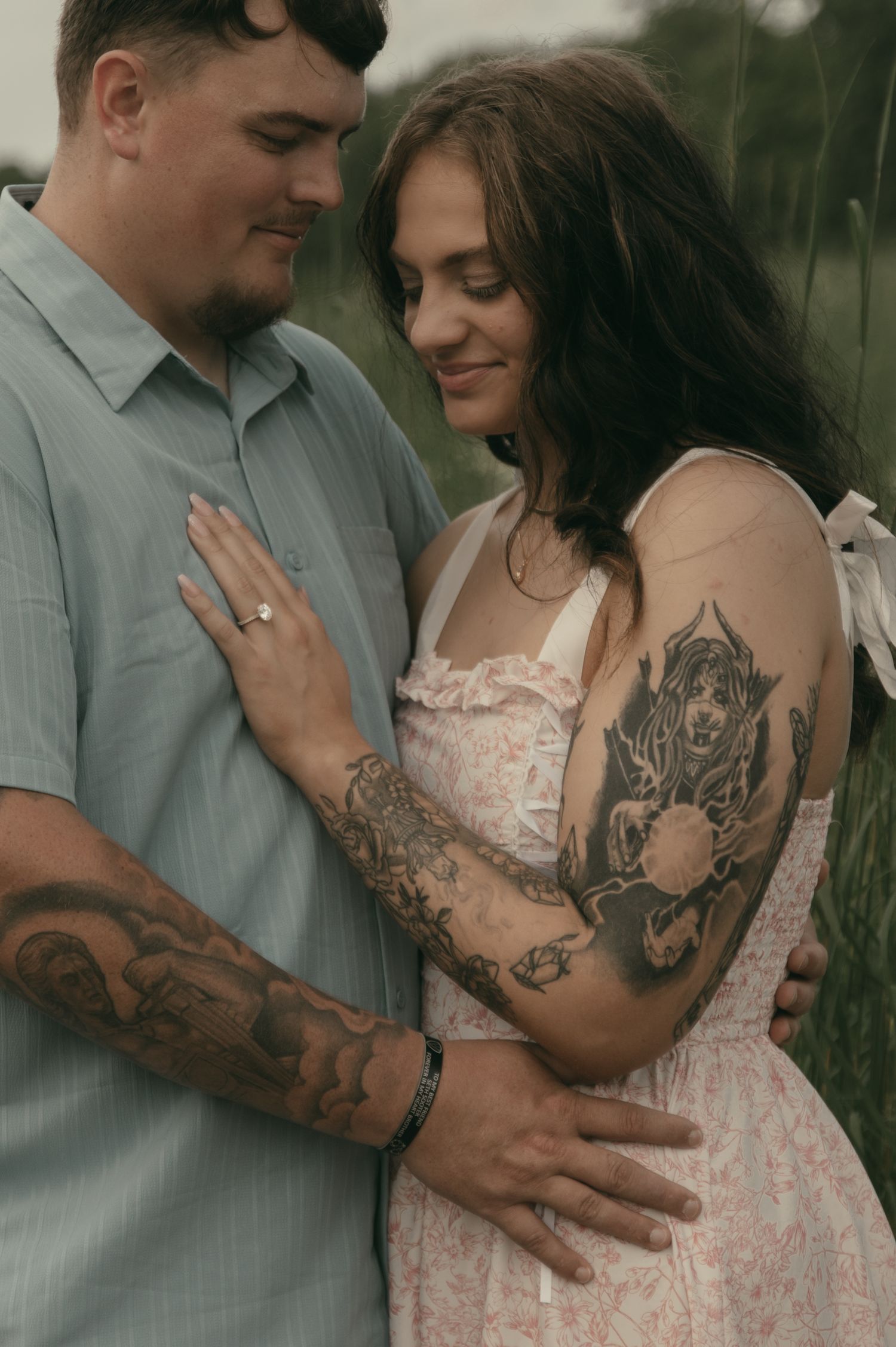 Engaged couple being intimate in Lake County Ohio by Gypsy Lens Photography. Moody, filmy, vintage, documentary wedding photography