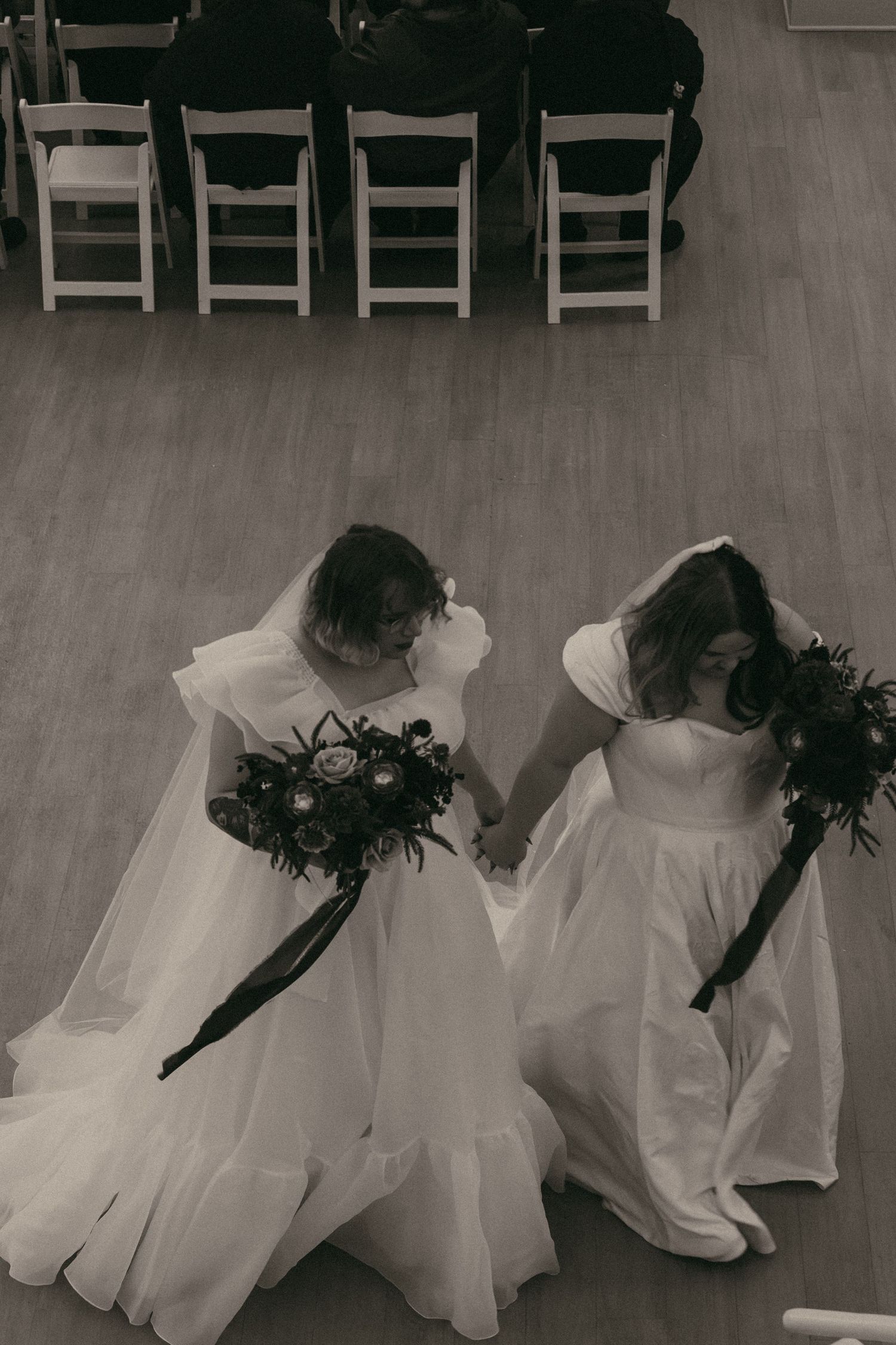 Brides after getting married walking in Cleveland Ohio by Gypsy Lens Photography. Moody, filmy, vintage, documentary wedding photography.
