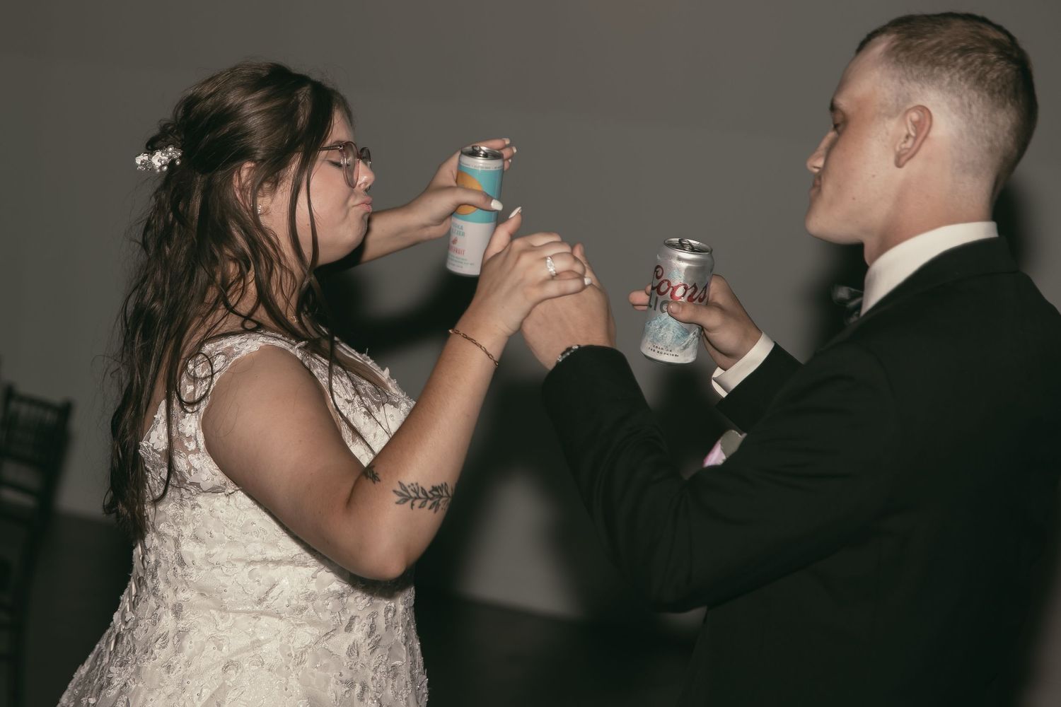 Bride and groom at reception in Cleveland Ohio by Gypsy Lens Photography. Moody, vintage, documentary wedding photographer.