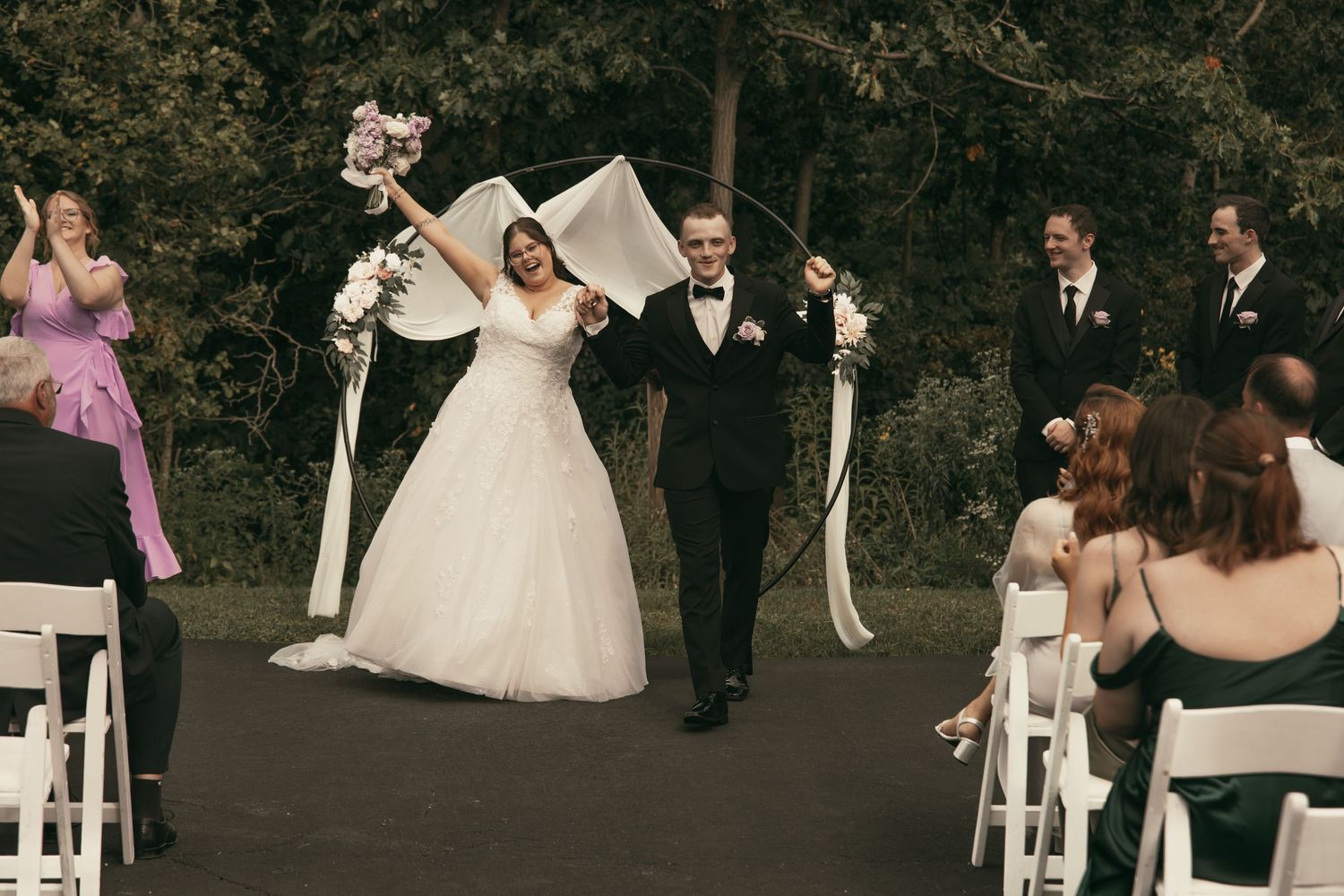 Happy newlyweds at ceremony in Cleveland Ohio by Gypsy Lens Photography. Moody, vintage, documentary wedding photographer.
