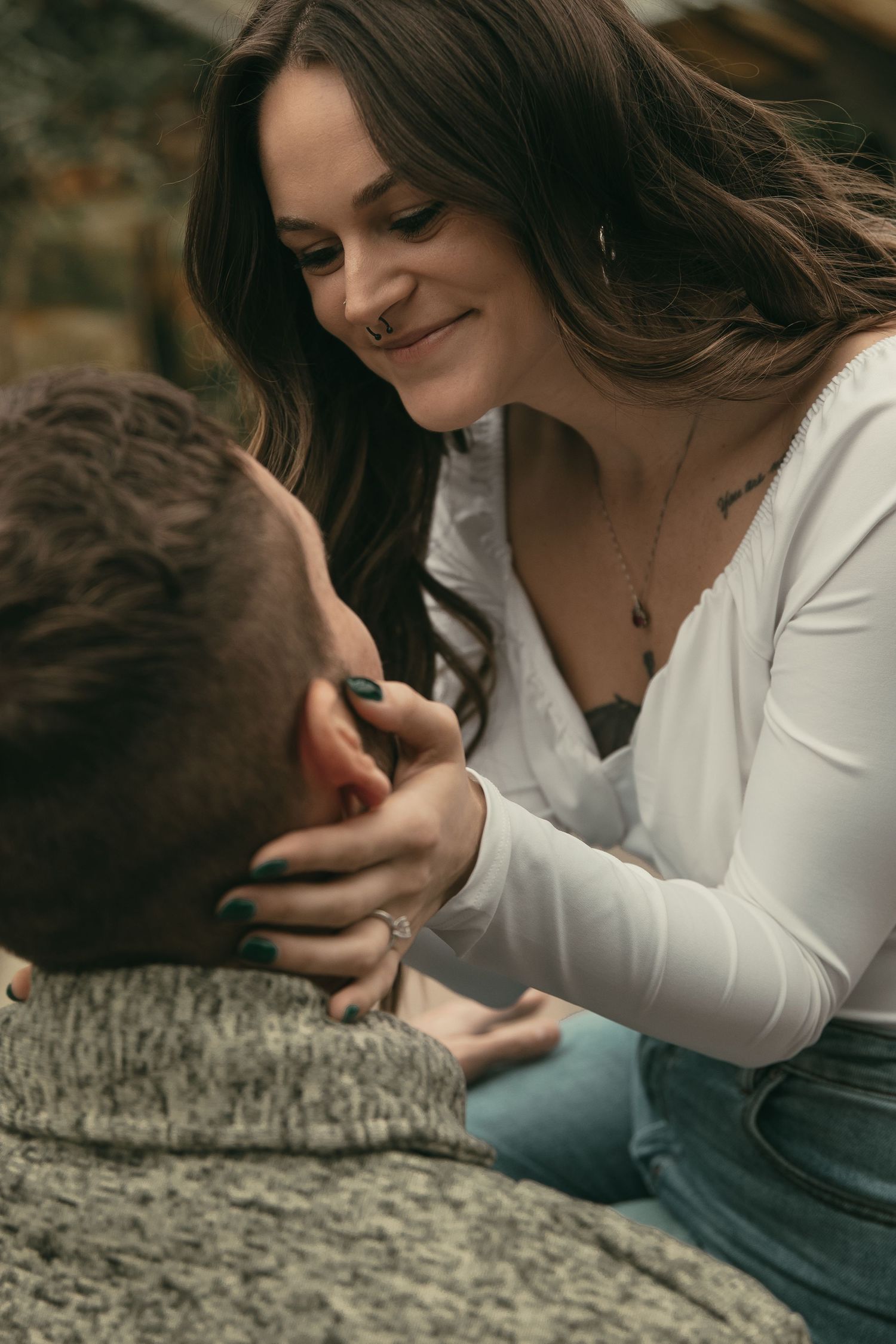Engaged couple kiss at greenhouse in Cleveland Ohio by Gypsy Lens Photography. Moody, filmy, vintage, documentary wedding photography