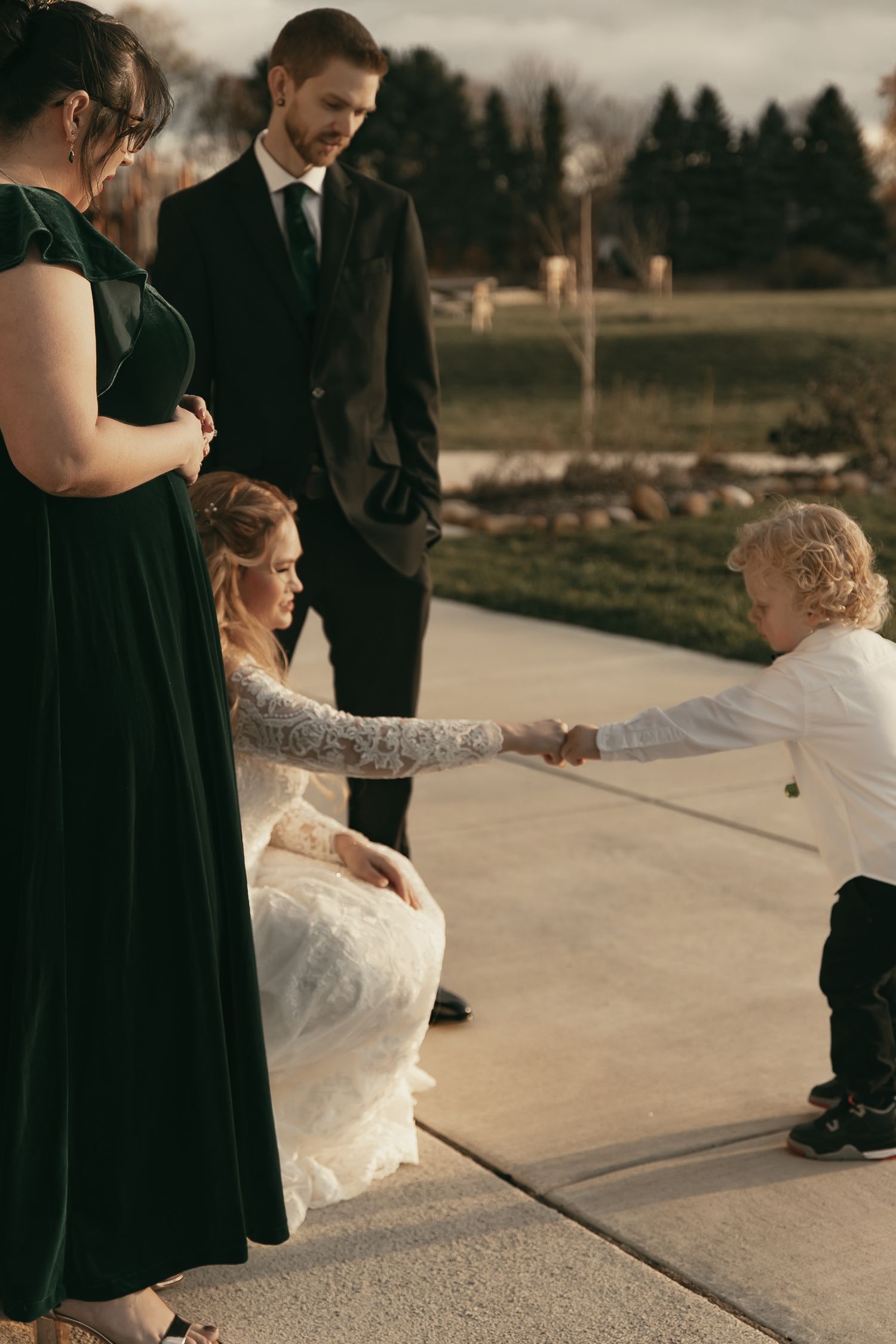 Cinematic sunset family portraits at wedding in Lake County Ohio by Gypsy Lens Photography. Moody, vintage, documentary wedding photography.