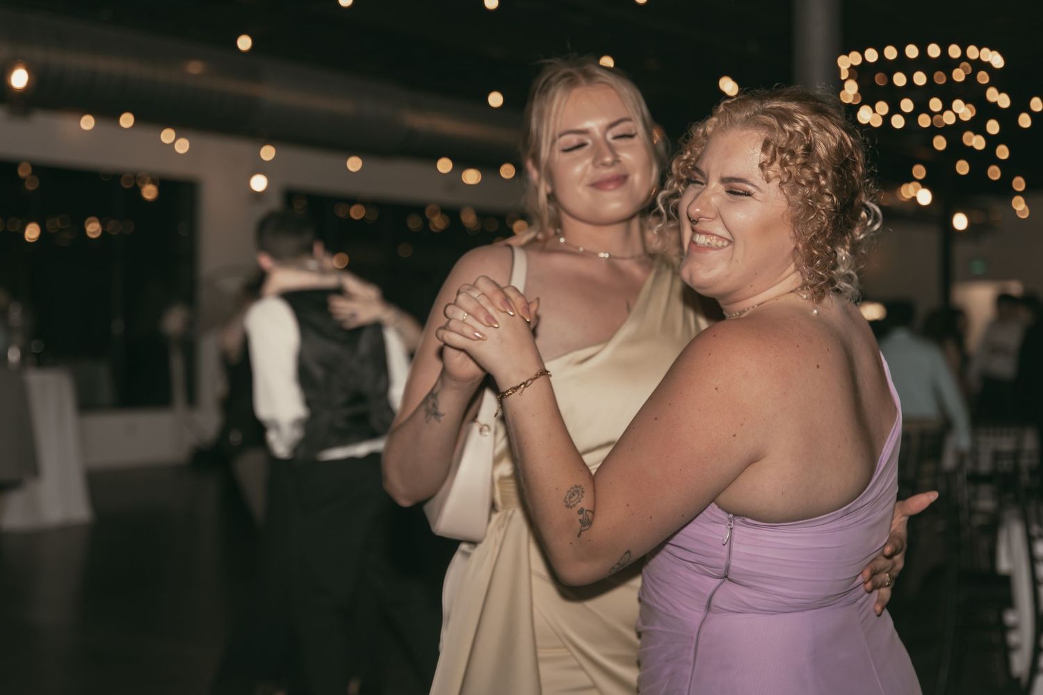 Wedding guests dancing at reception in Cleveland Ohio by Gypsy Lens Photography. Moody, vintage, documentary wedding photographer.