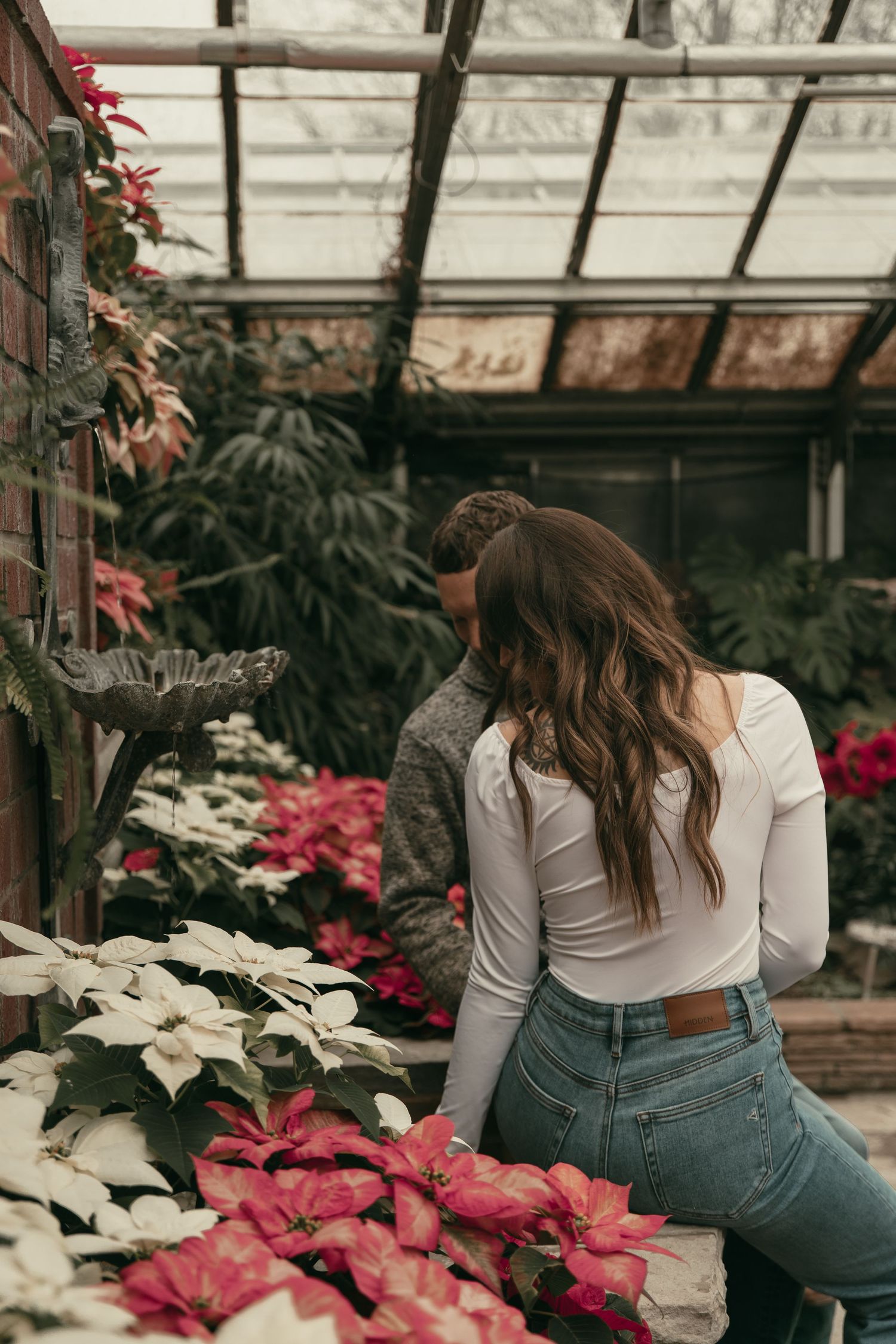 Engaged couple at greenhouse in Cleveland Ohio by Gypsy Lens Photography. Moody, filmy, vintage, documentary wedding photography
