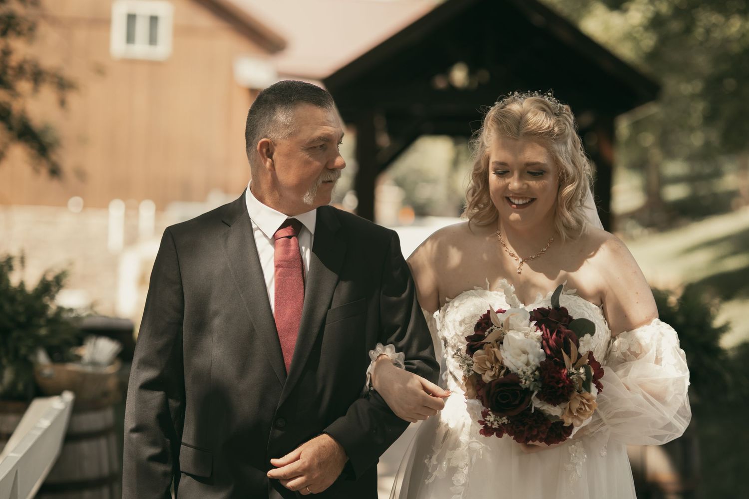 Dad and daughter walking down the aisle in Wooster Ohio by Gypsy Lens Photography. Moody, vintage, nostalgic, documentary wedding.