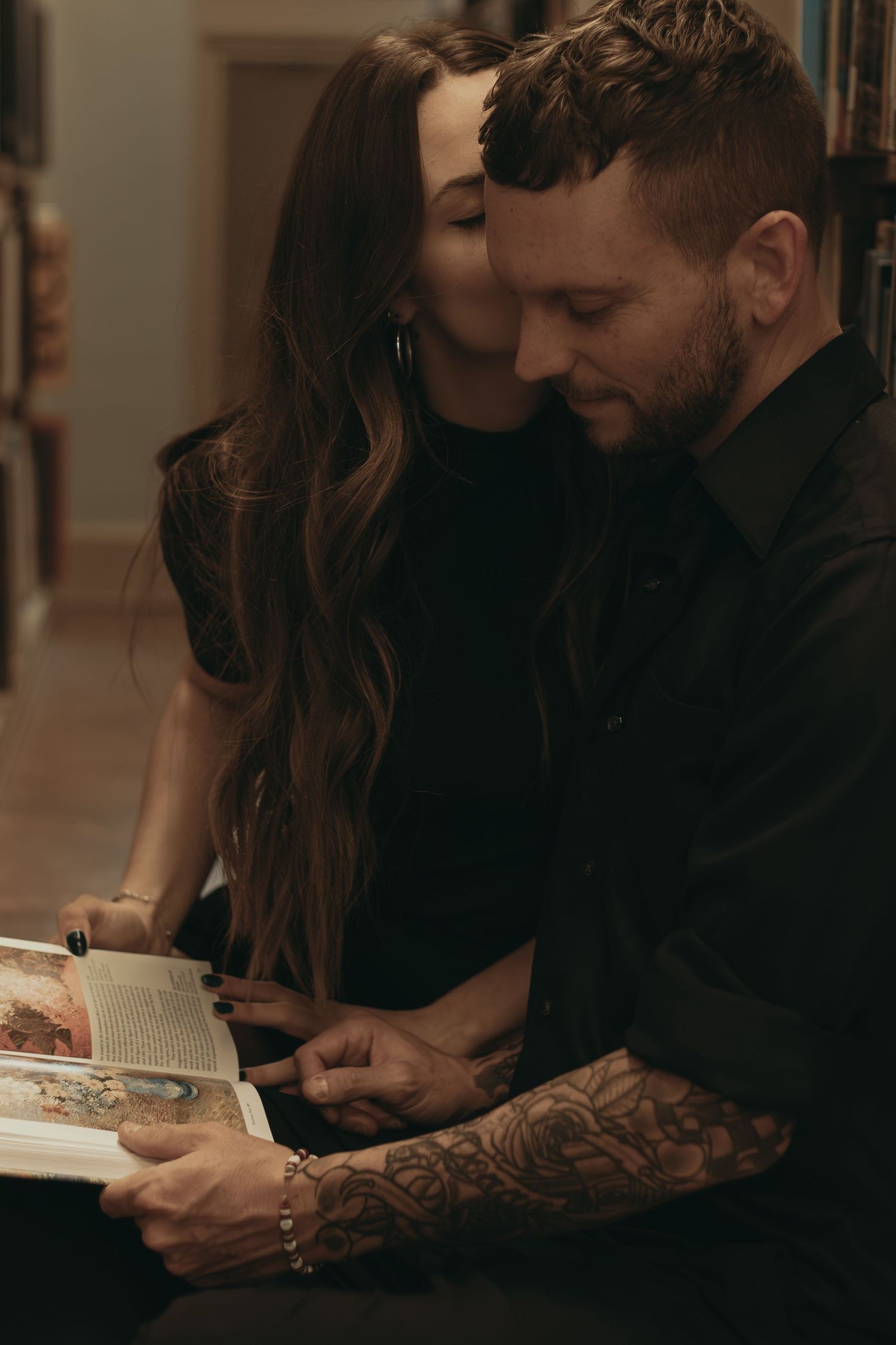 Couple reading together at library in Cleveland Ohio by Gypsy Lens Photography. Moody, filmy, vintage, documentary wedding photography