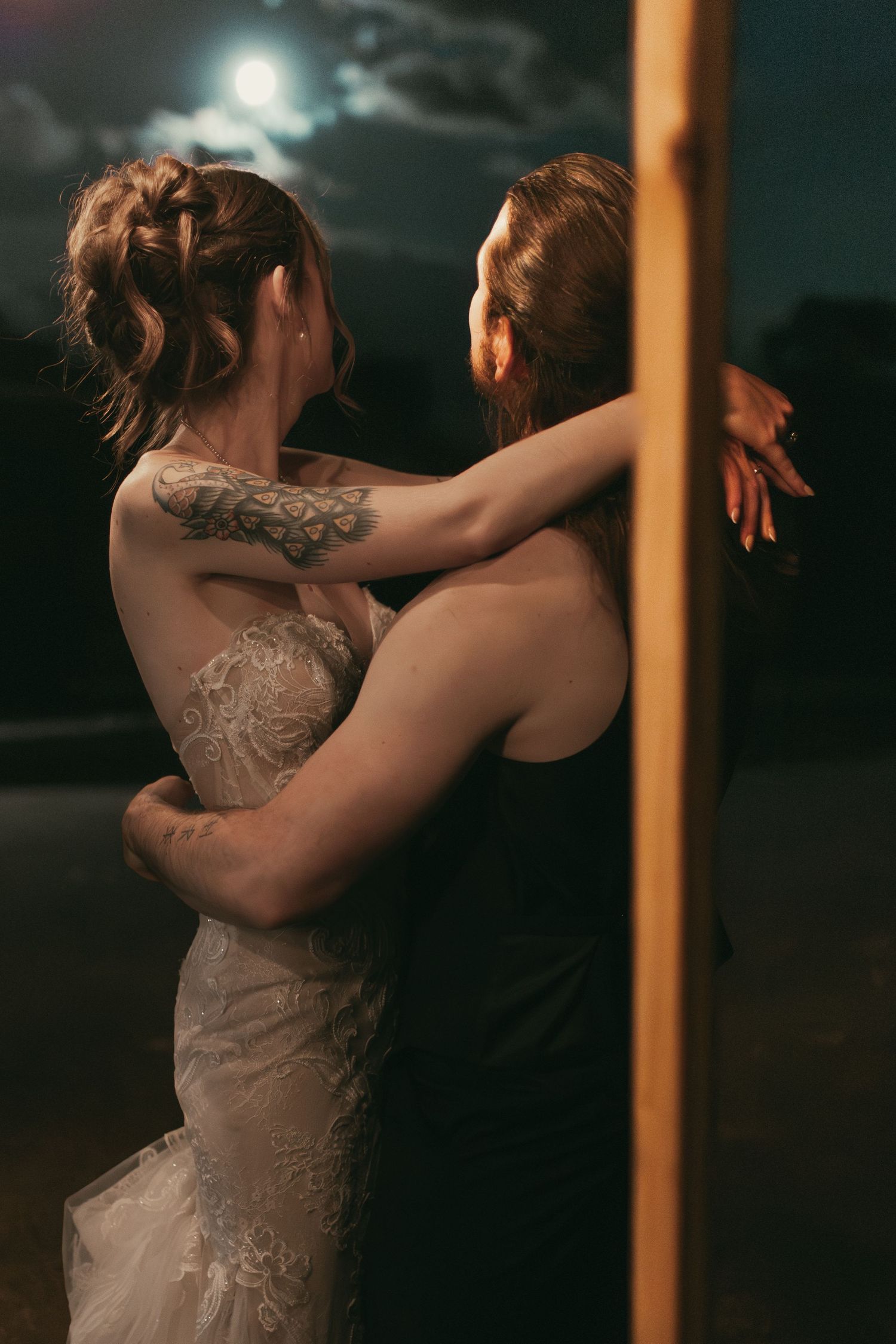 Newlyweds dancing in the moonlight in Hermitage Pennsylvania by Gypsy Lens Photography. Moody, vintage, documentary wedding photo.