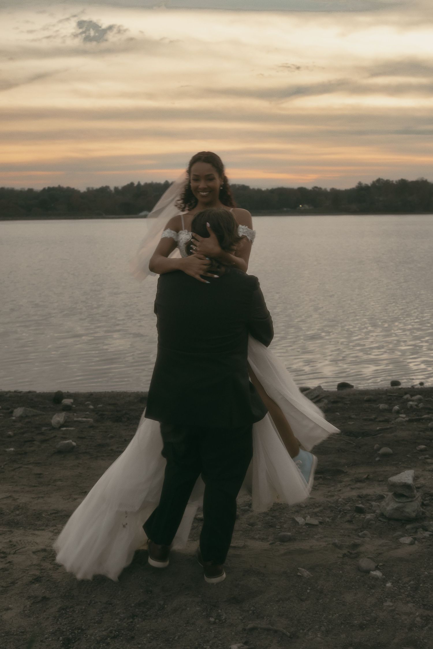 Grainy vintage couple dancing at beach in Cleveland Ohio by Gypsy Lens Photography. Moody, filmy, vintage, documentary wedding photography.