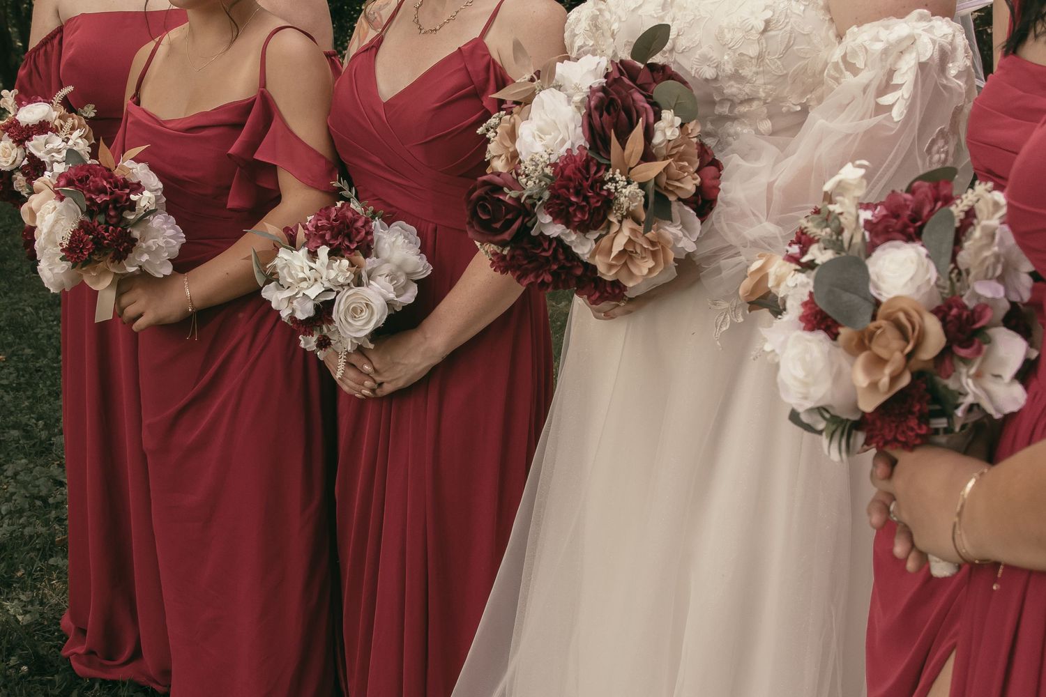 Bridesmaids holding bridal bouquets in Wooster Ohio by Gypsy Lens Photography. Moody, intimate, nostalgic, documentary wedding photographer.
