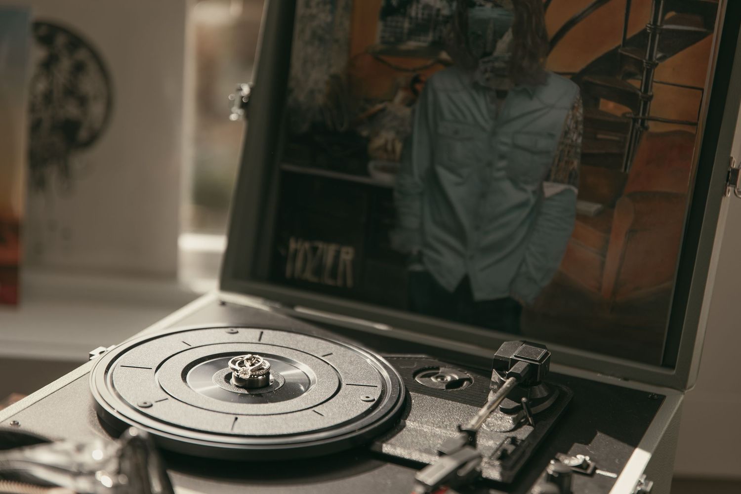 Record player displaying wedding rings in Cleveland Ohio by Gypsy Lens Photography. Moody, vintage, documentary wedding photography.
