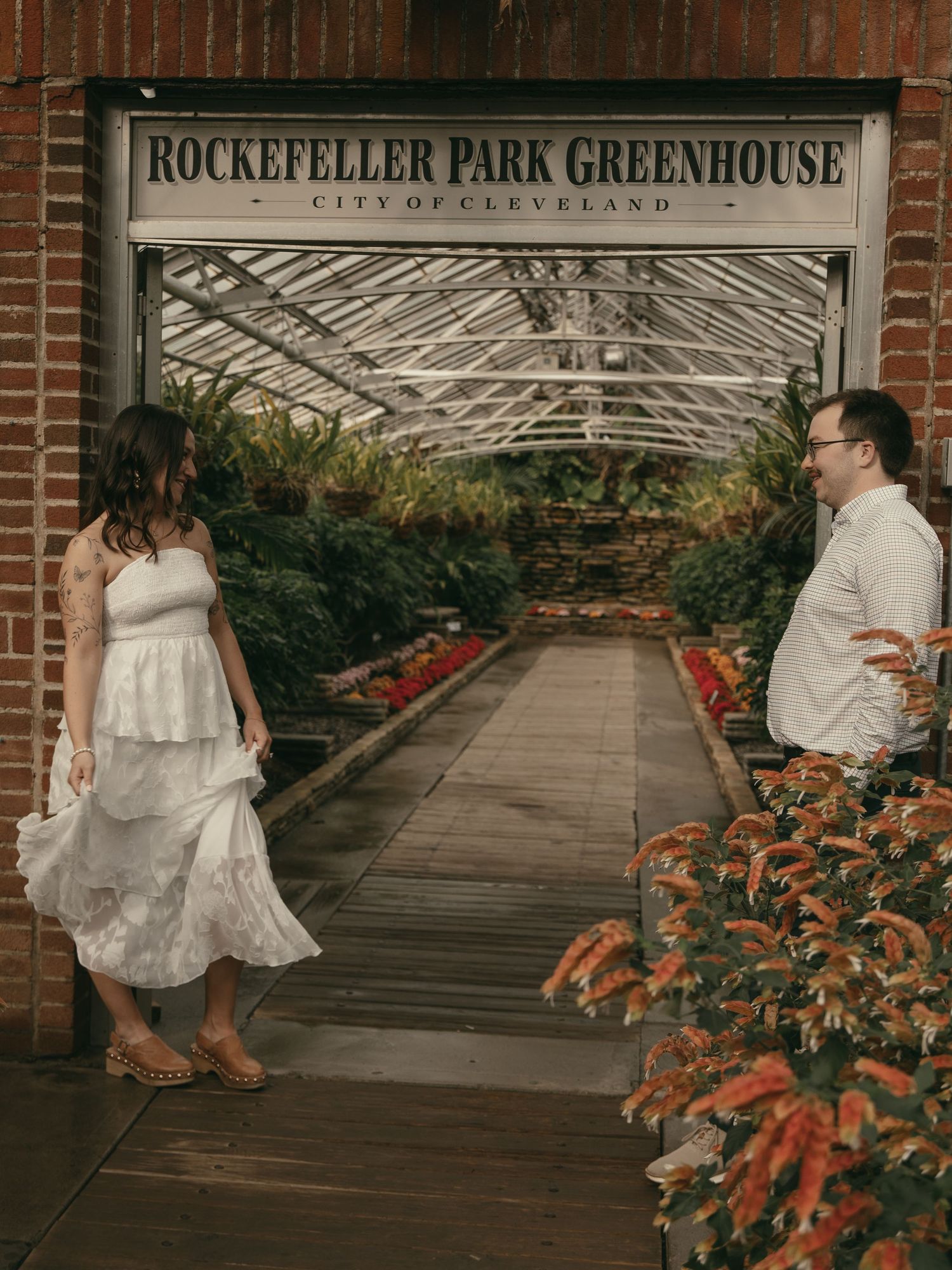 Engaged couple at Rockefeller Greenhouse Cleveland OH by Gypsy Lens Photography. Moody, nostalgic, vintage, documentary wedding photography