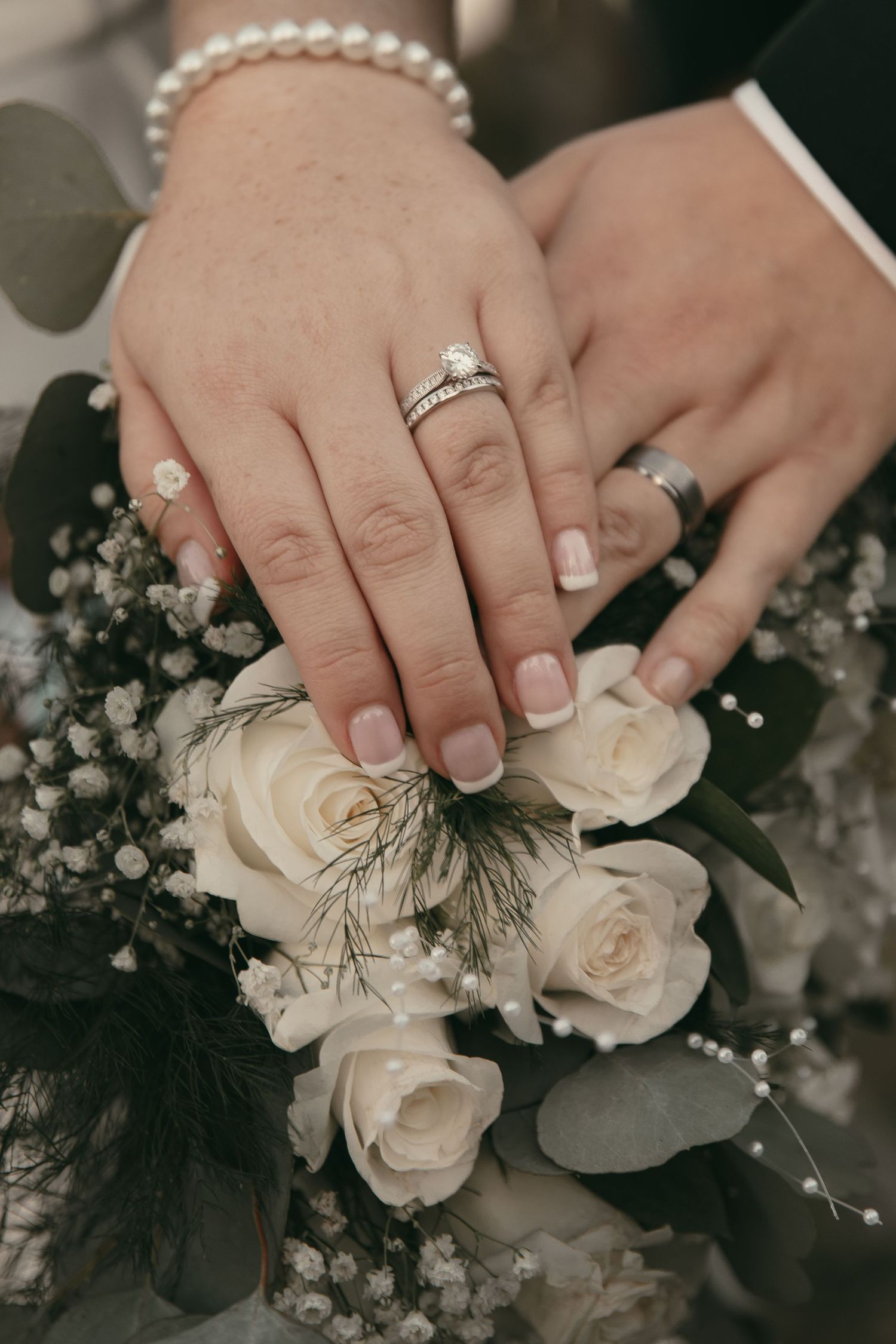 Brides rings detail with wedding bouquet in Cleveland Ohio by Gypsy Lens Photography. Moody, vintage, documentary wedding photography.