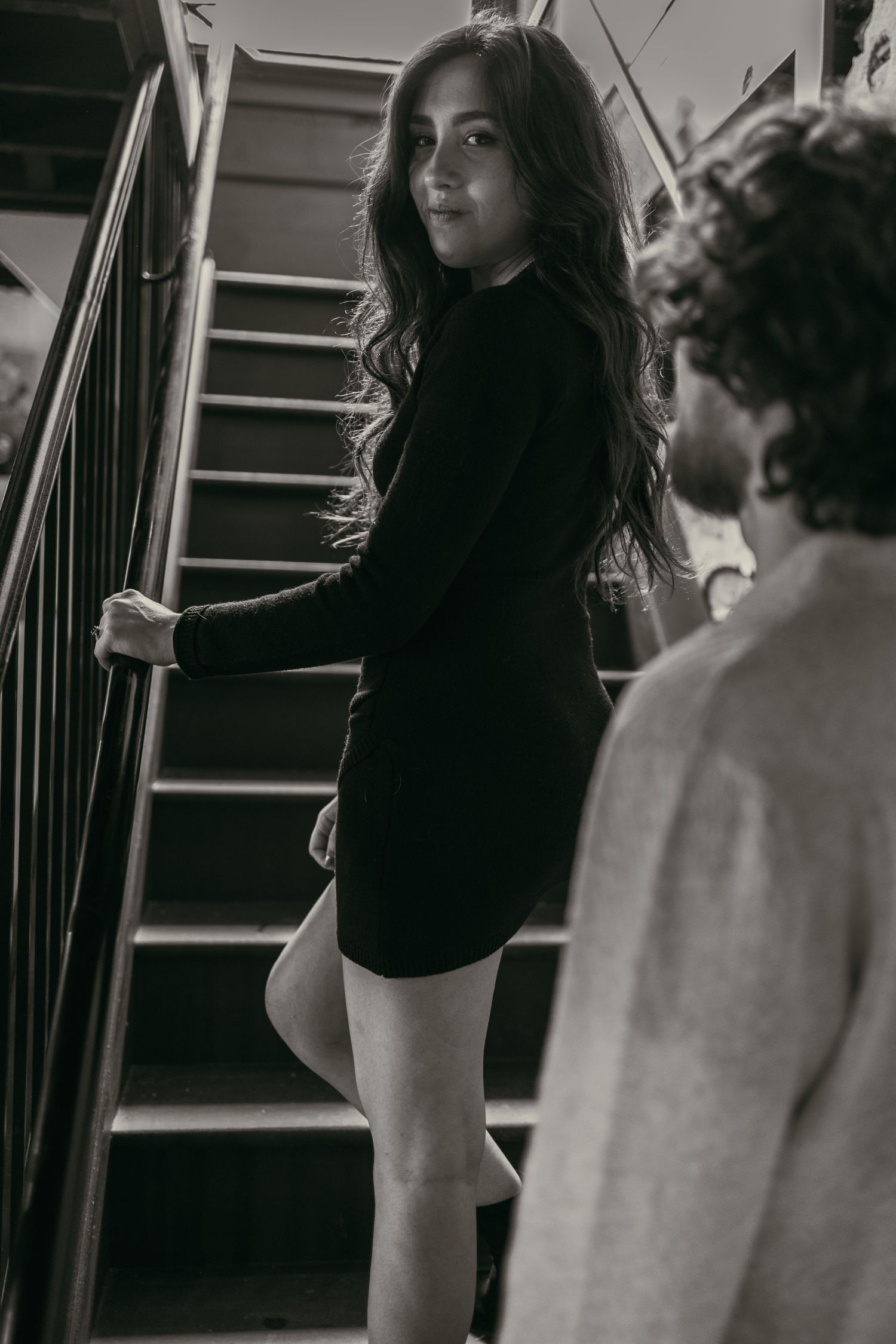 Engaged couple share intimate moment in Cleveland Ohio by Gypsy Lens Photography. Moody, vintage, documentary wedding photographer.
