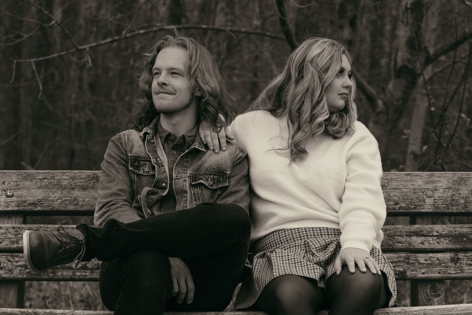 Dreamy couple sitting on a bench in Lake County Ohio by Gypsy Lens Photography. Moody, filmy, vintage, documentary wedding photography
