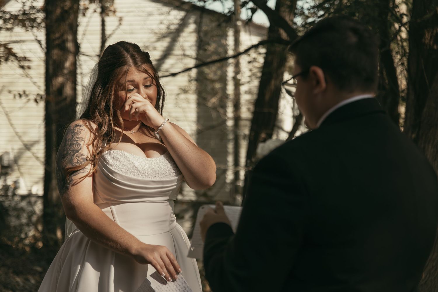 Brides emotionally exchanging vows in Cleveland Ohio by Gypsy Lens Photography. Moody, vintage, documentary wedding photography.
