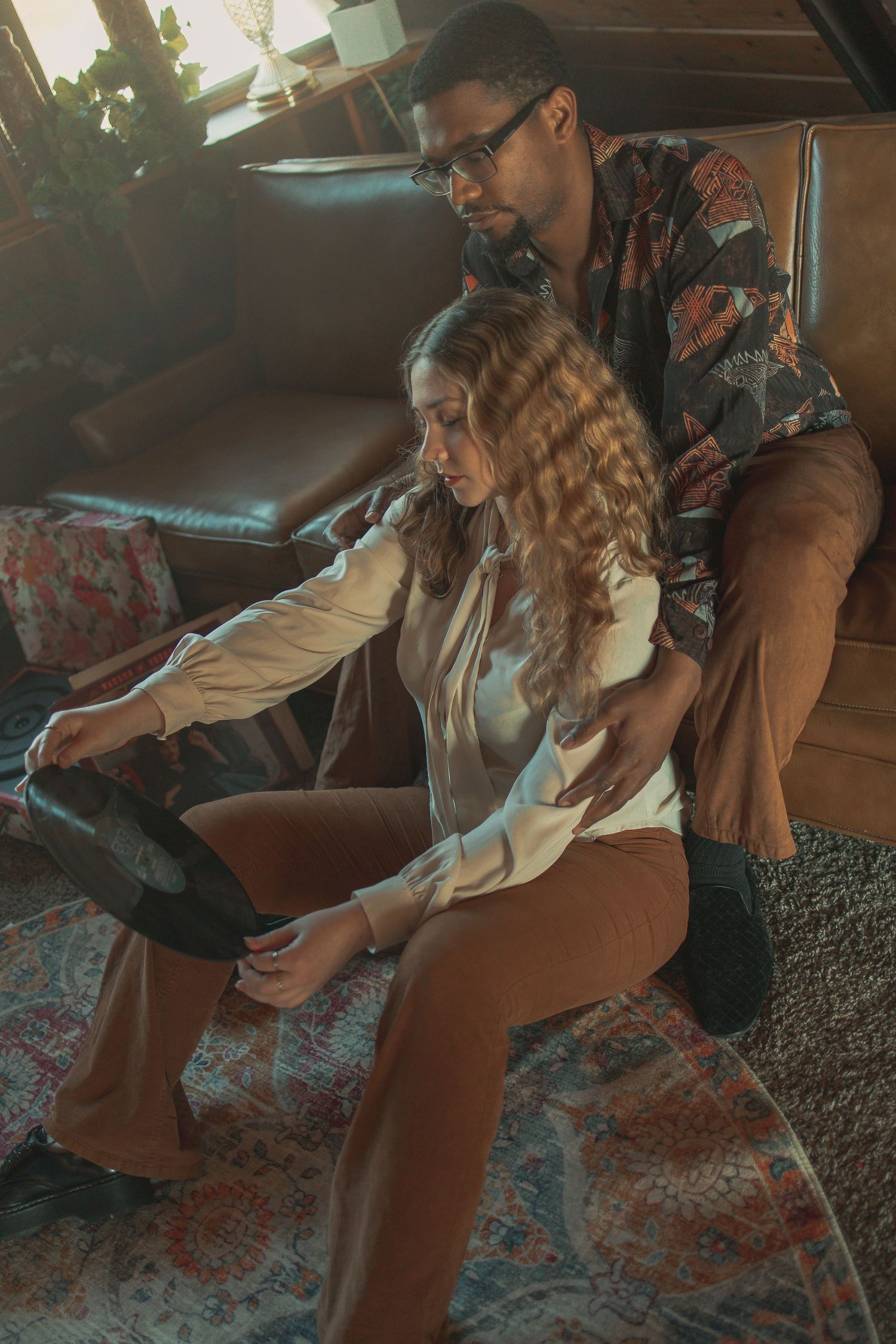 Vintage couple on a date with records in Akron Ohio by Gypsy Lens Photography. Moody, vintage, documentary wedding photography.