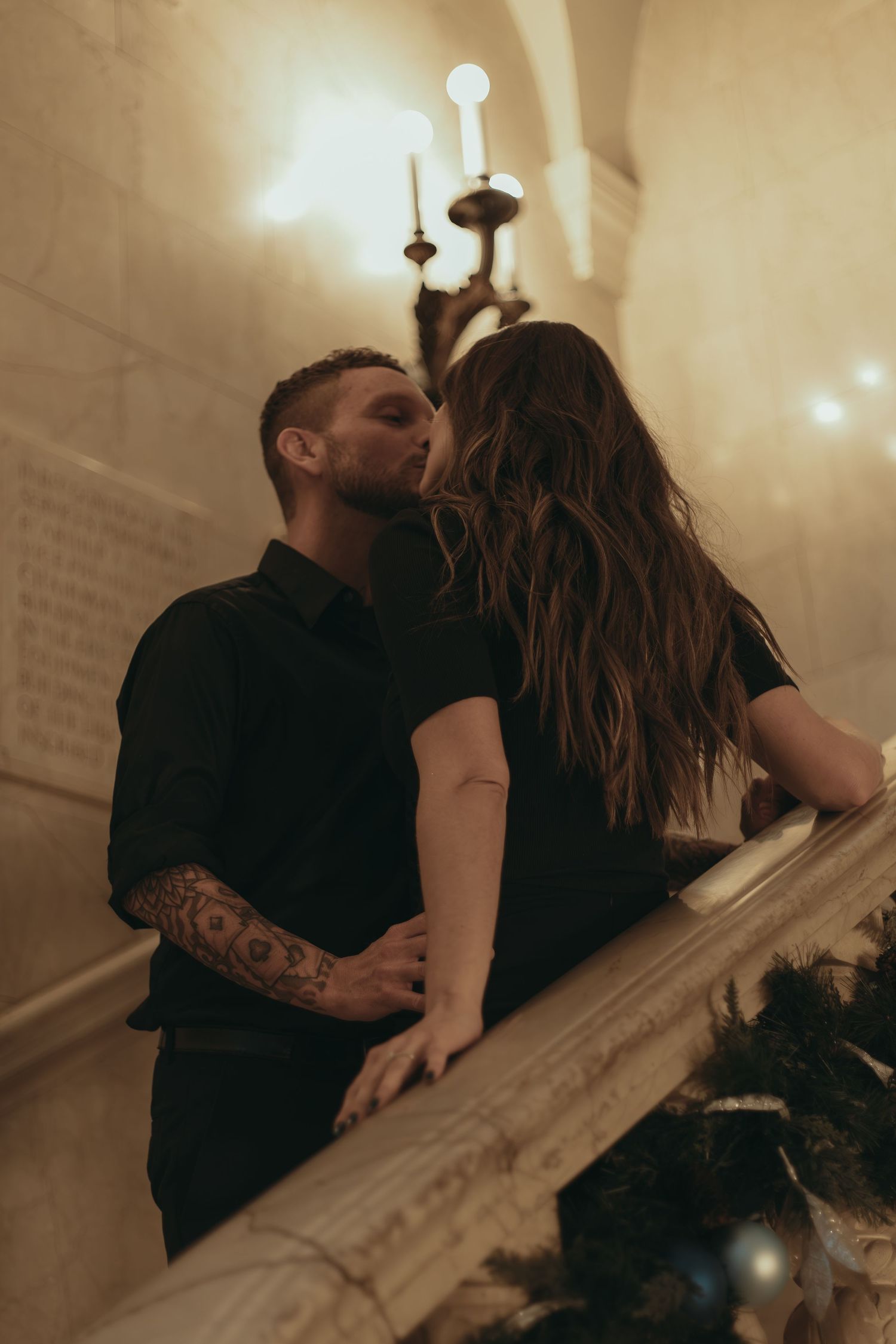 Engaged couple kissing at library in Cleveland Ohio by Gypsy Lens Photography. Moody, filmy, vintage, documentary wedding photography