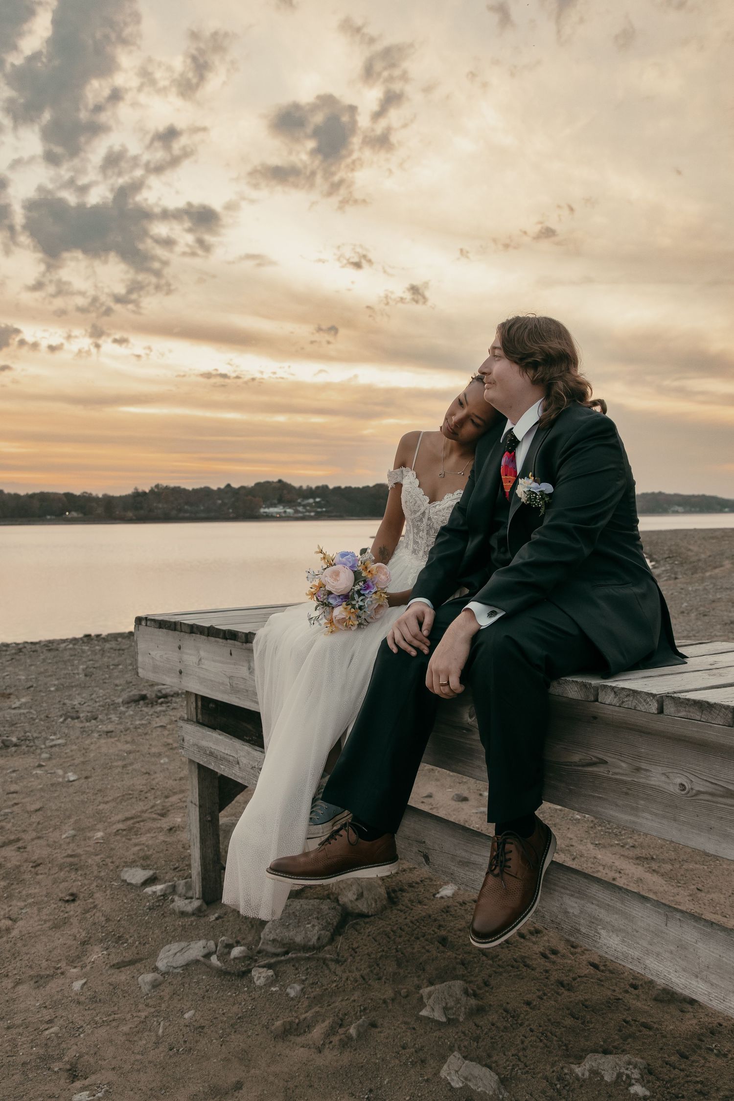Bridal portraits on beach at sunset in Cleveland Ohio by Gypsy Lens Photography. Moody, vintage, documentary wedding photography.