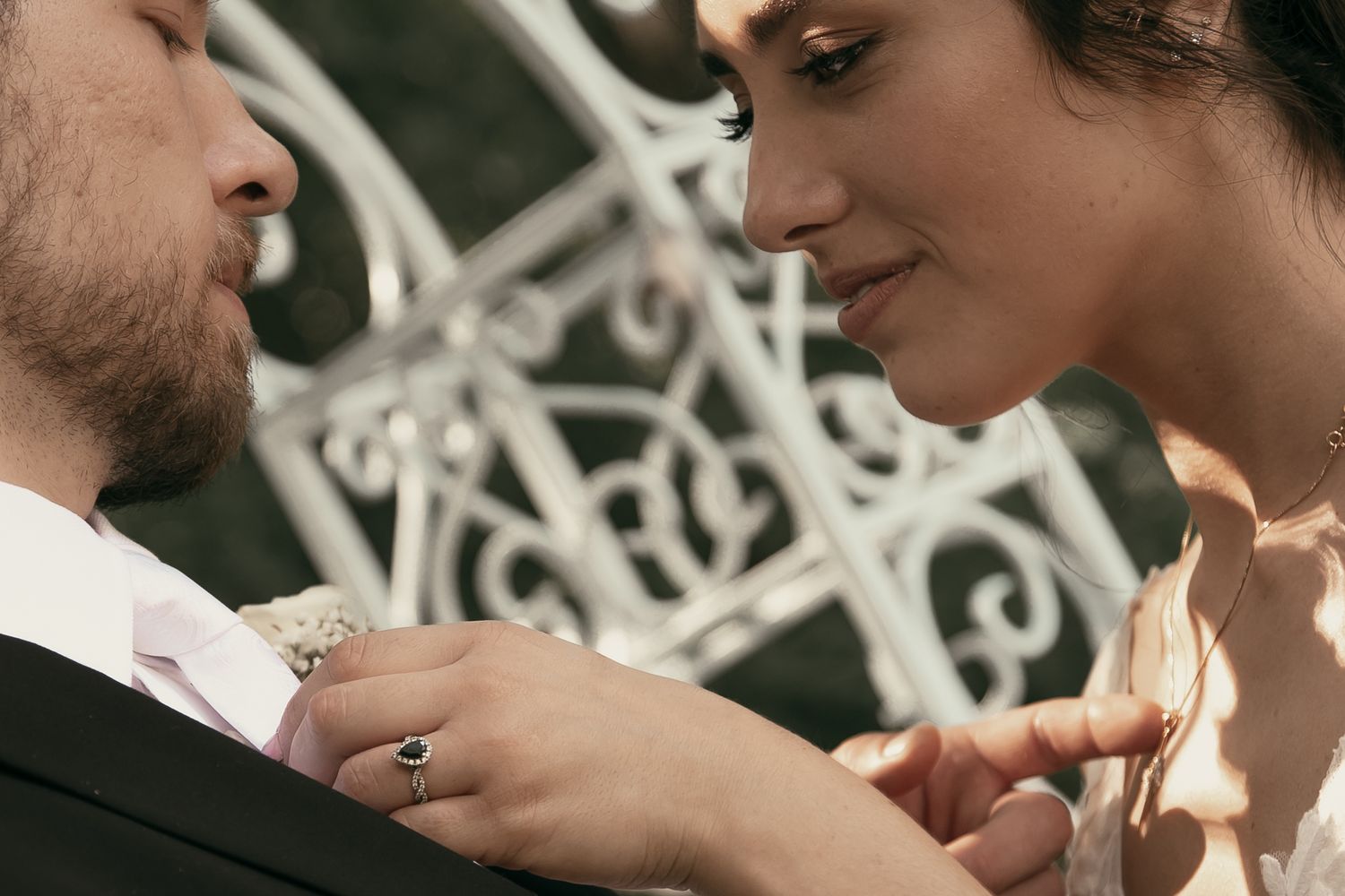 Close-up of tender moment between newlyweds in Cleveland Ohio by Gypsy Lens Photography. Moody, vintage, nostalgic, documentary wedding.