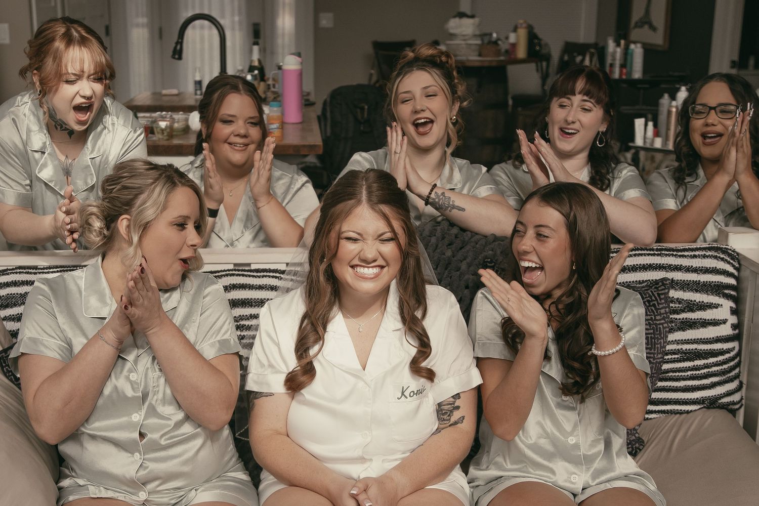 Bridesmaids cheering on bride on wedding day in Cleveland Ohio by Gypsy Lens Photography. Moody, vintage, documentary wedding photography.